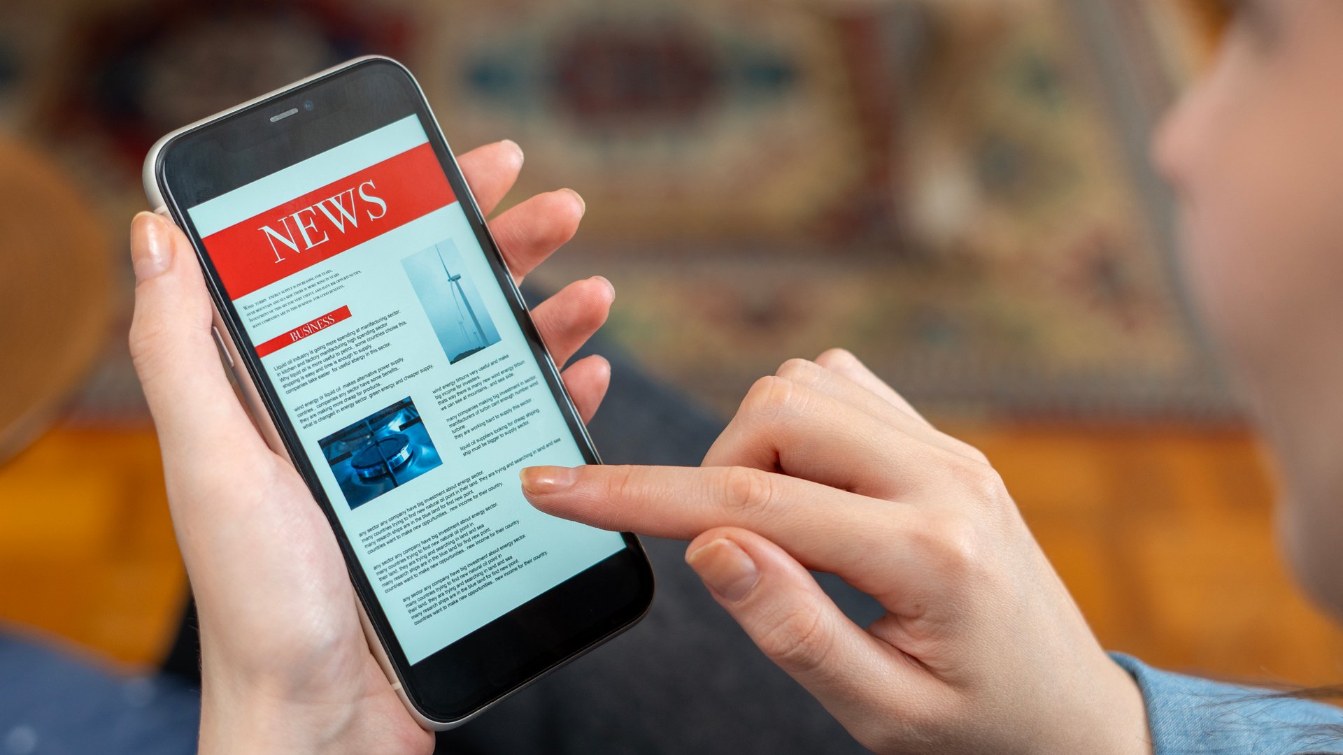 woman reading news at smart phone