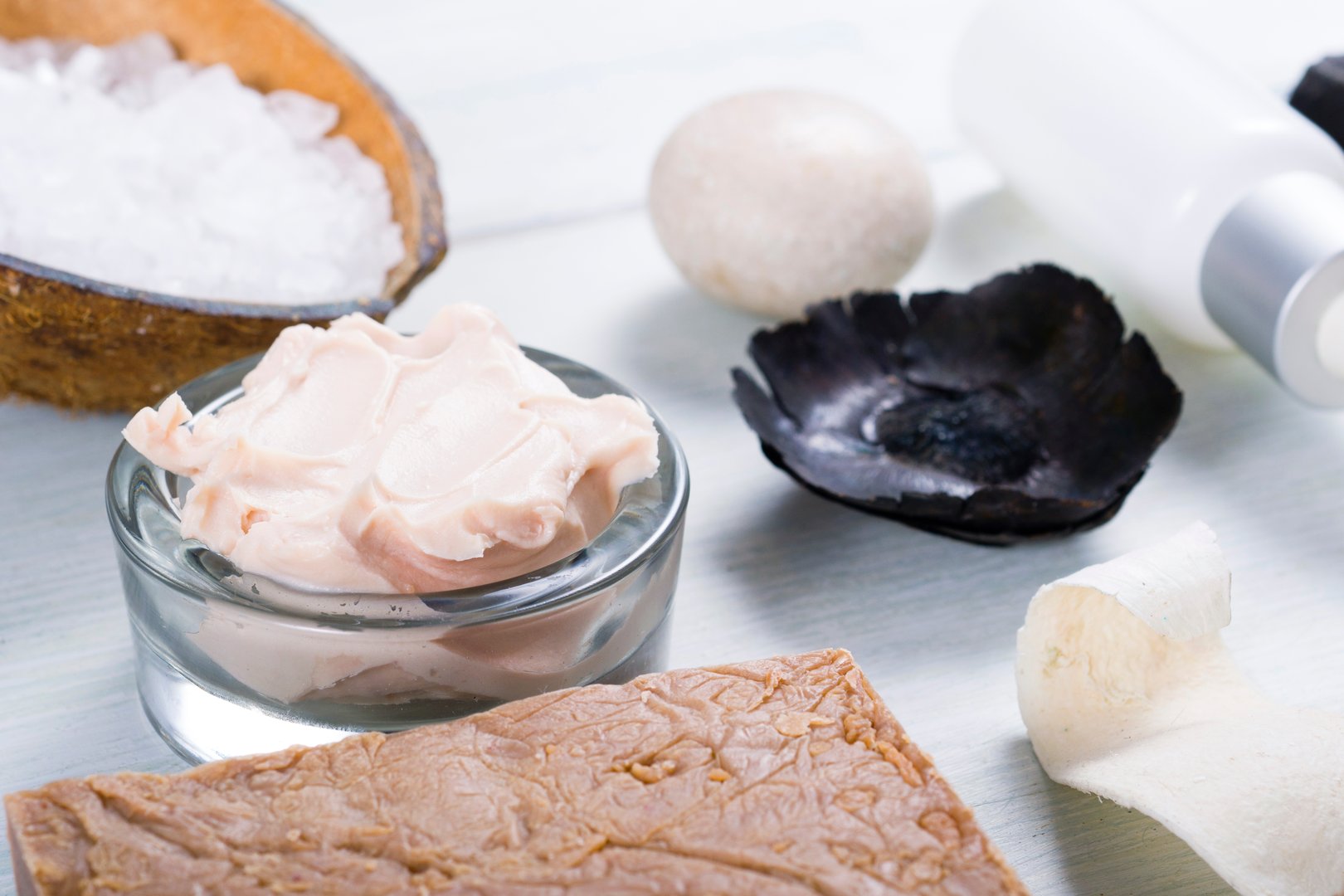 beauty and spa products on white wood table