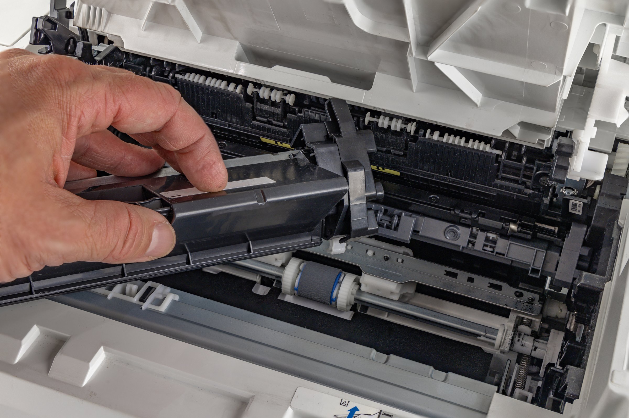Removing a used ink cartridge from a printer in the office