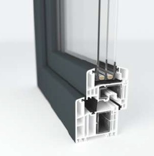 Cross-section of a window frame showing layers of insulation and construction materials, including glass and plastic components.