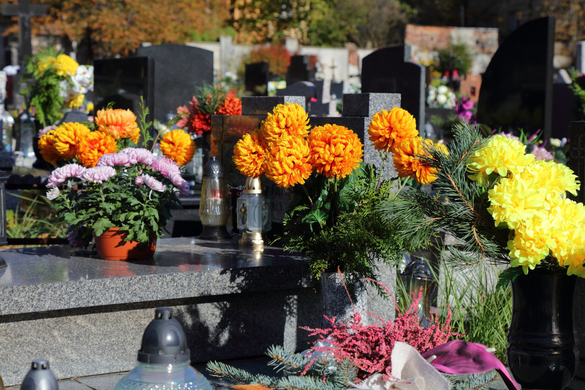 Decorated graves at a cemetery on All Saints Day (Wszystkich Swietych) in Poland.