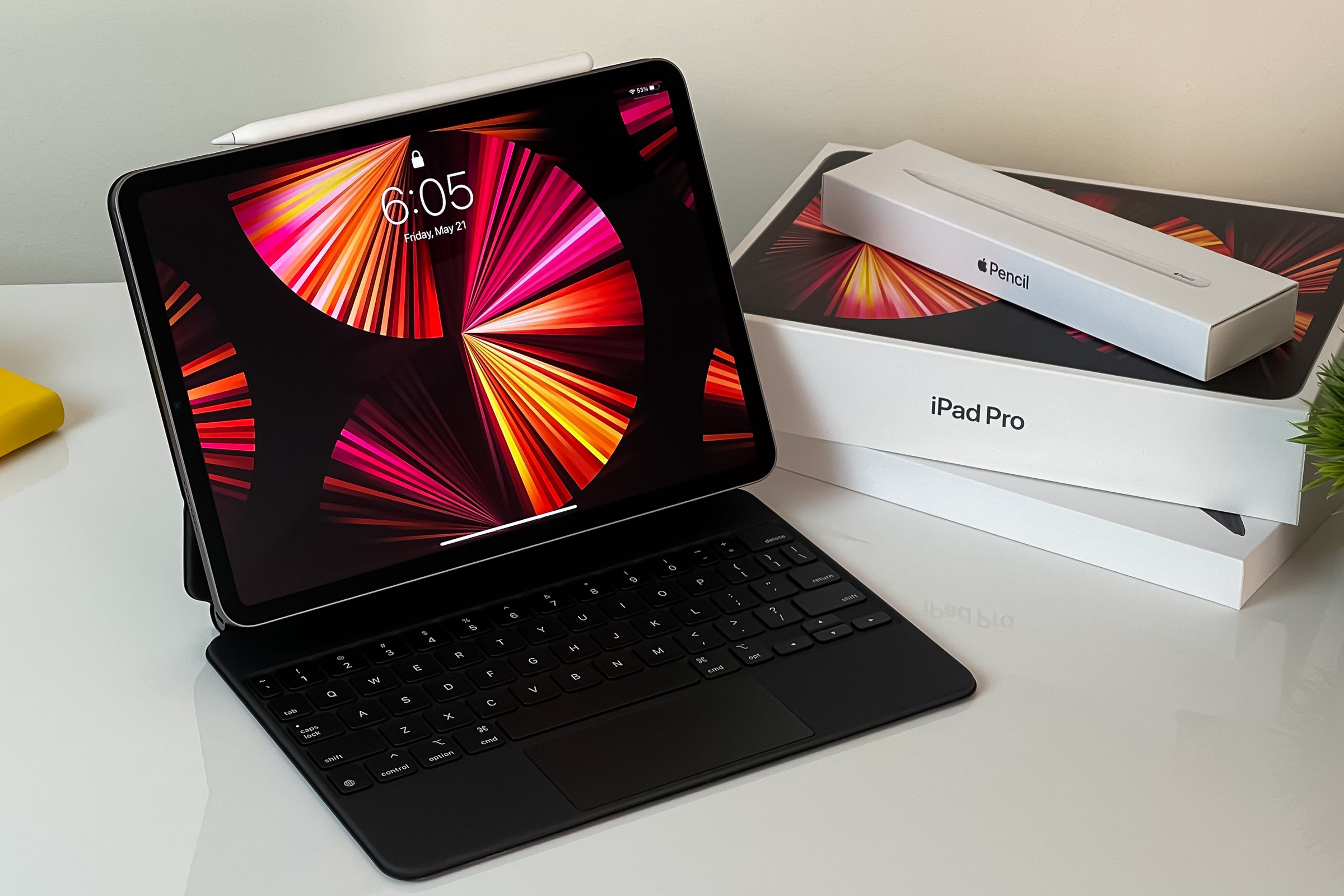 iPad Pro 11-inch 2021 model with Apple M1 chip on a desk with Magic keyboard and Apple pencil. New York, NY, USA May 21, 2021.