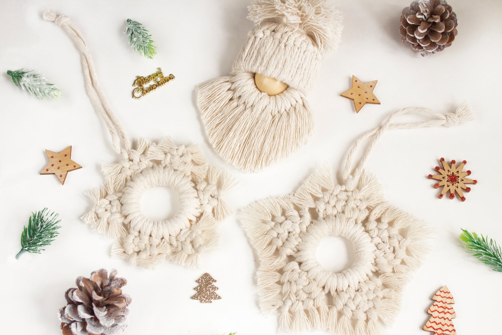 Christmas tree toys made of natural materials, cotton thread. Top view. New Year's layout of macrame products for Christmas, pendants on a white background. Eco decorations, ornaments, hand made decor