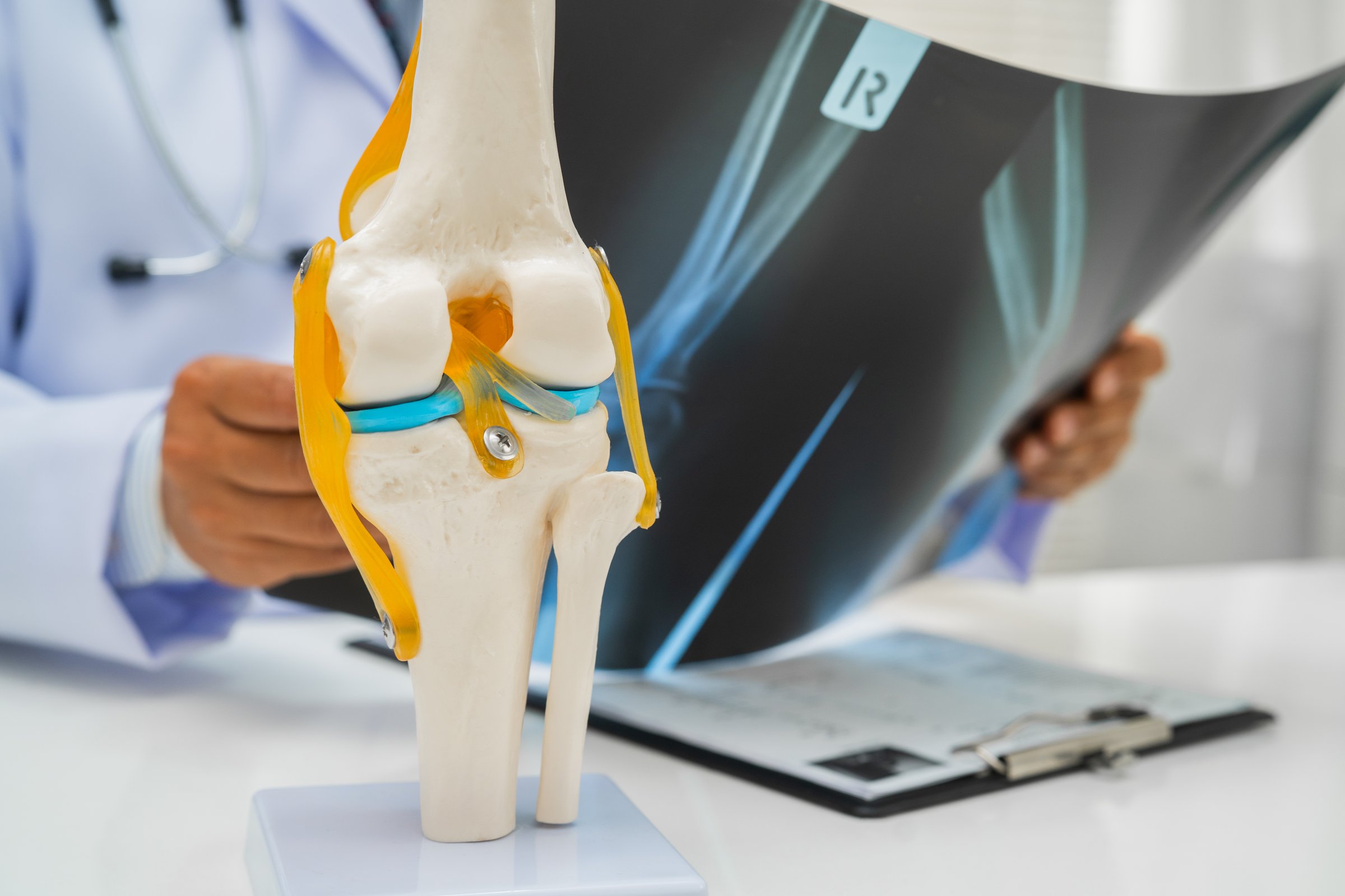 Doctor examining patient arm elbow for ulnar nerve compression