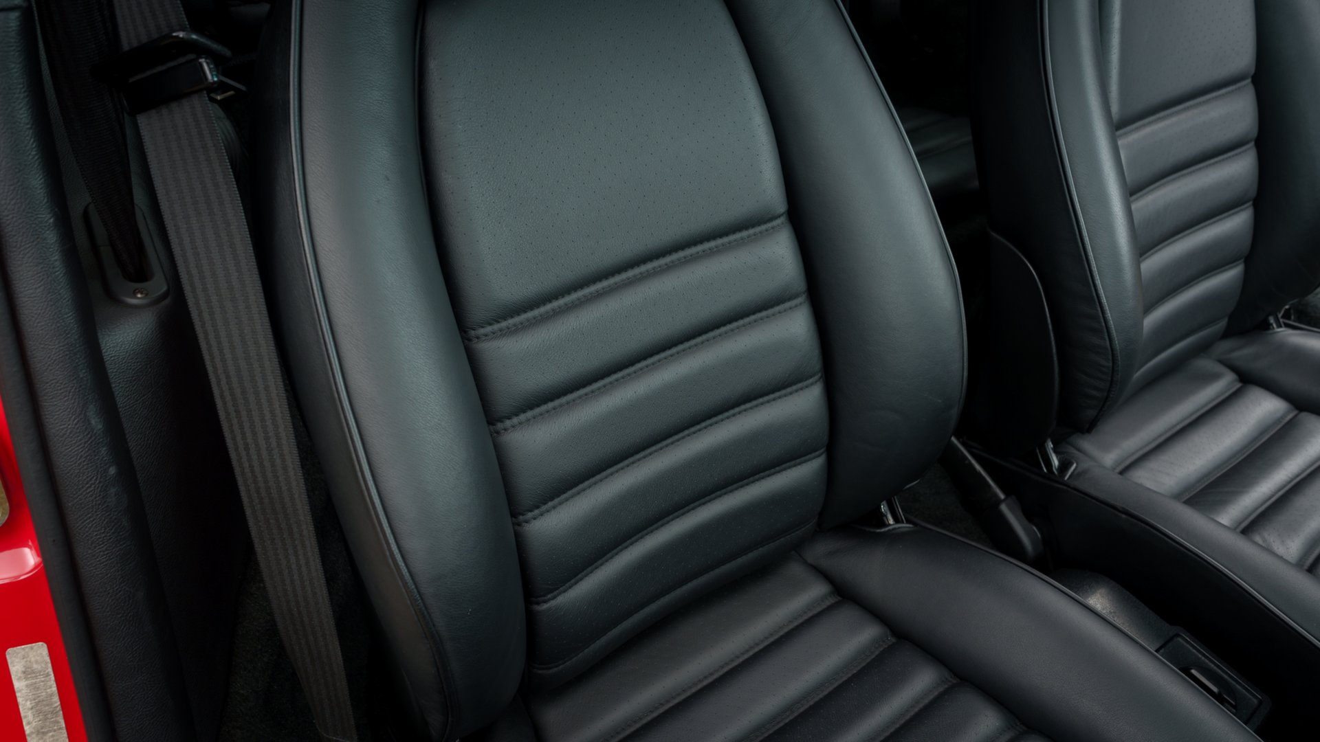 Black leather passenger seat and seat belt