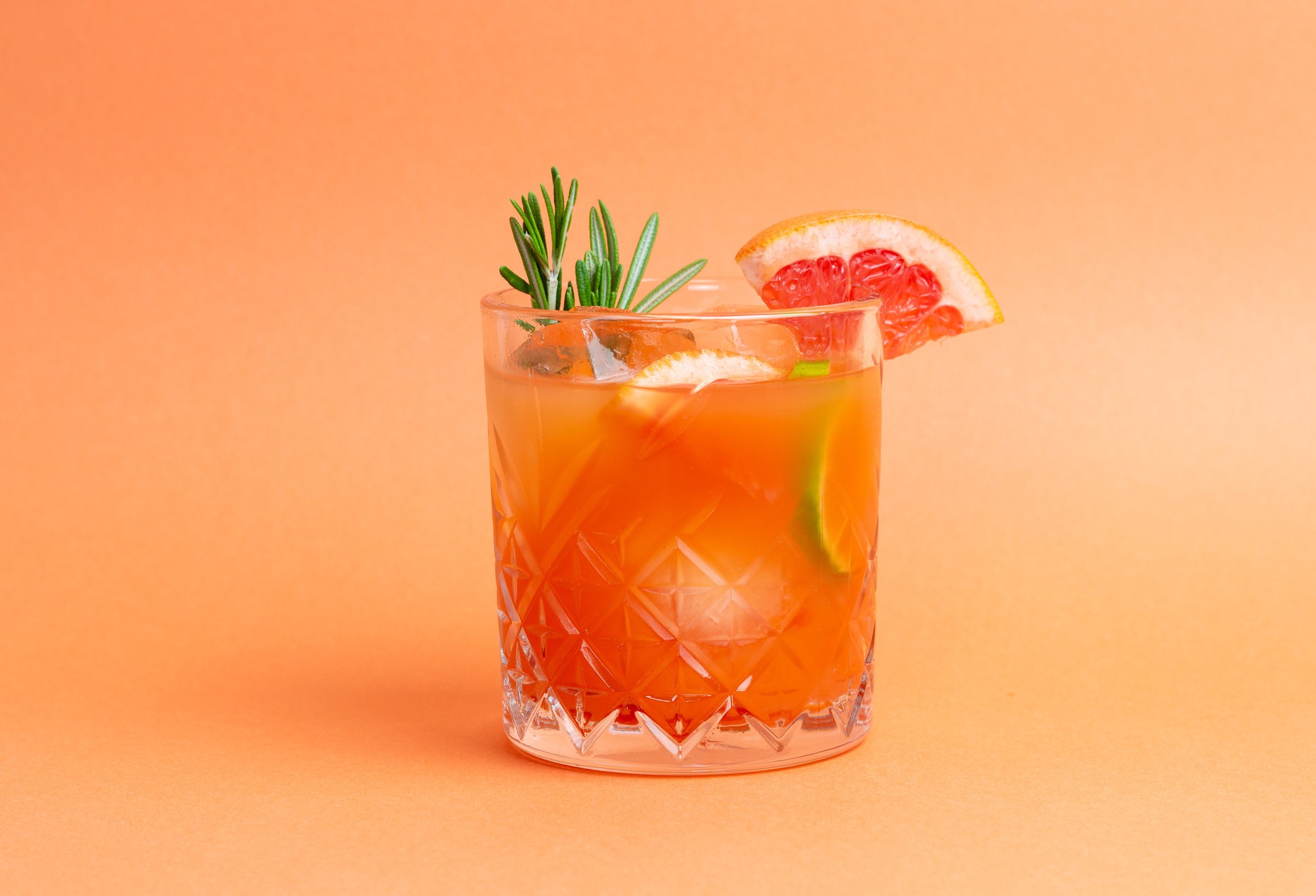 Paloma cocktail with grapefruit, lime and rosemary. Grapefruit juice. Alcohol. Tequila