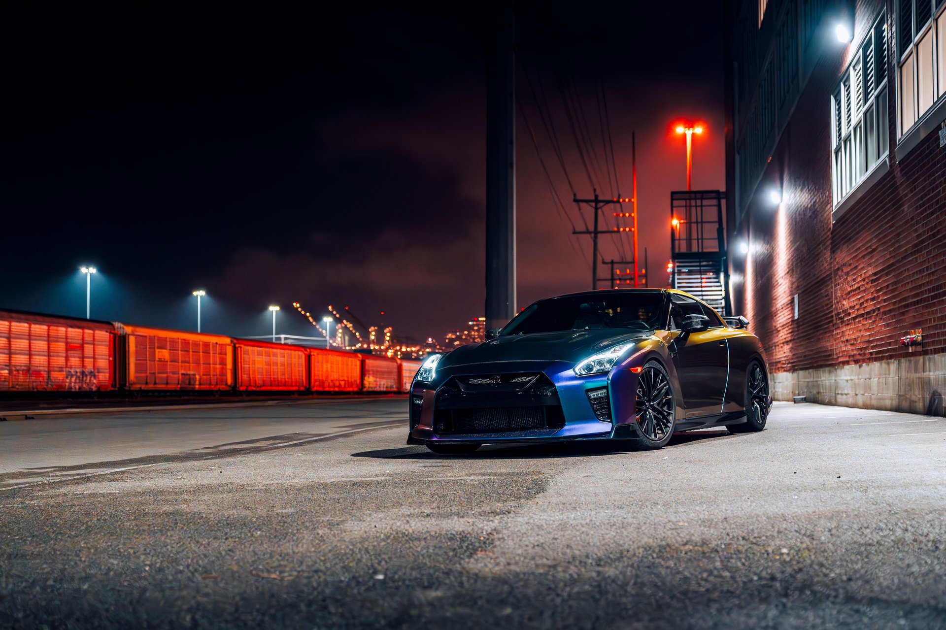 Seattle, WA, USAJanuary 22, 2025Nissan R35 GTR showing the front of the car with a rail road in the background