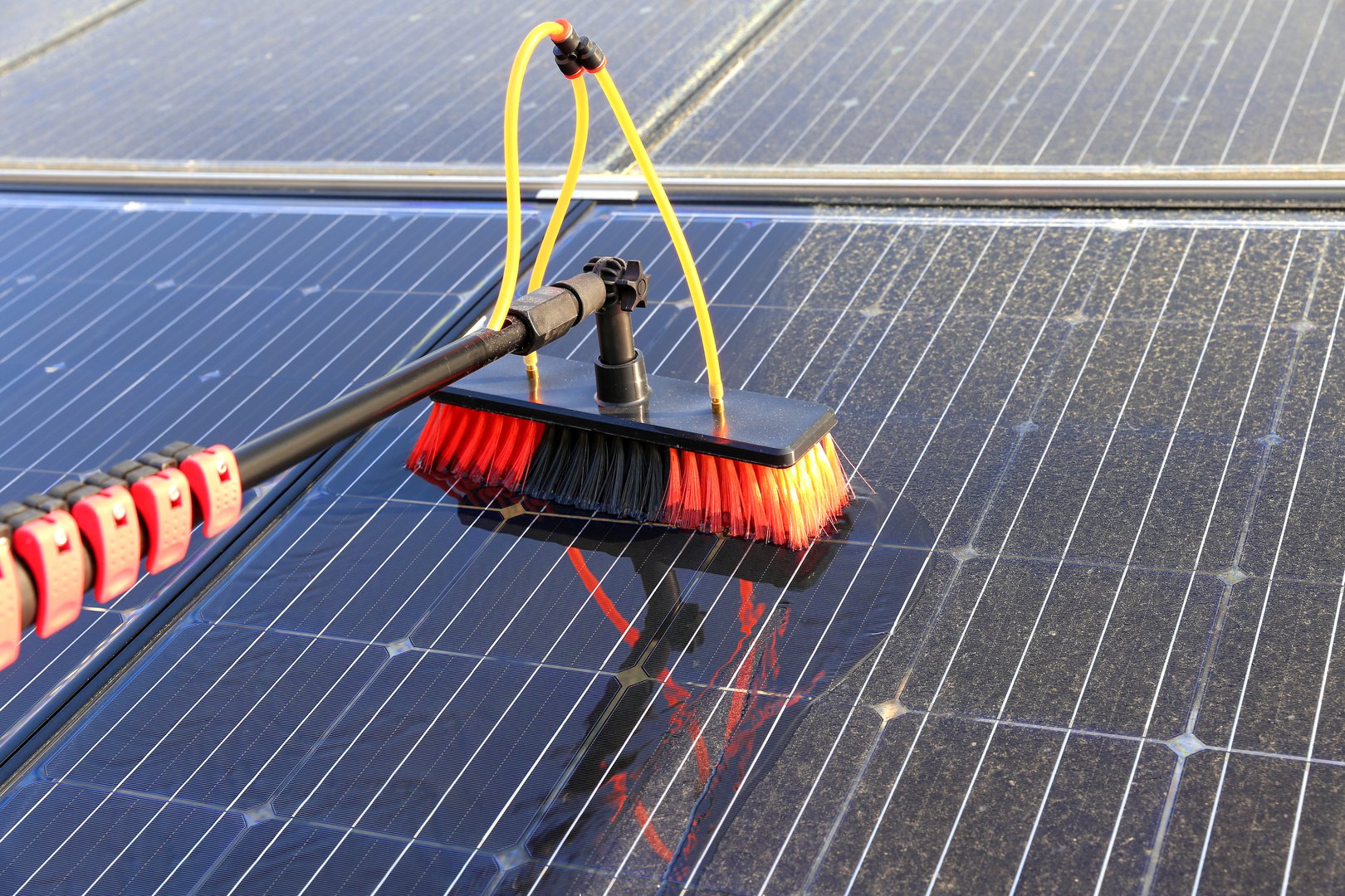 Cleaning of solar modules with water and a soft brush.
