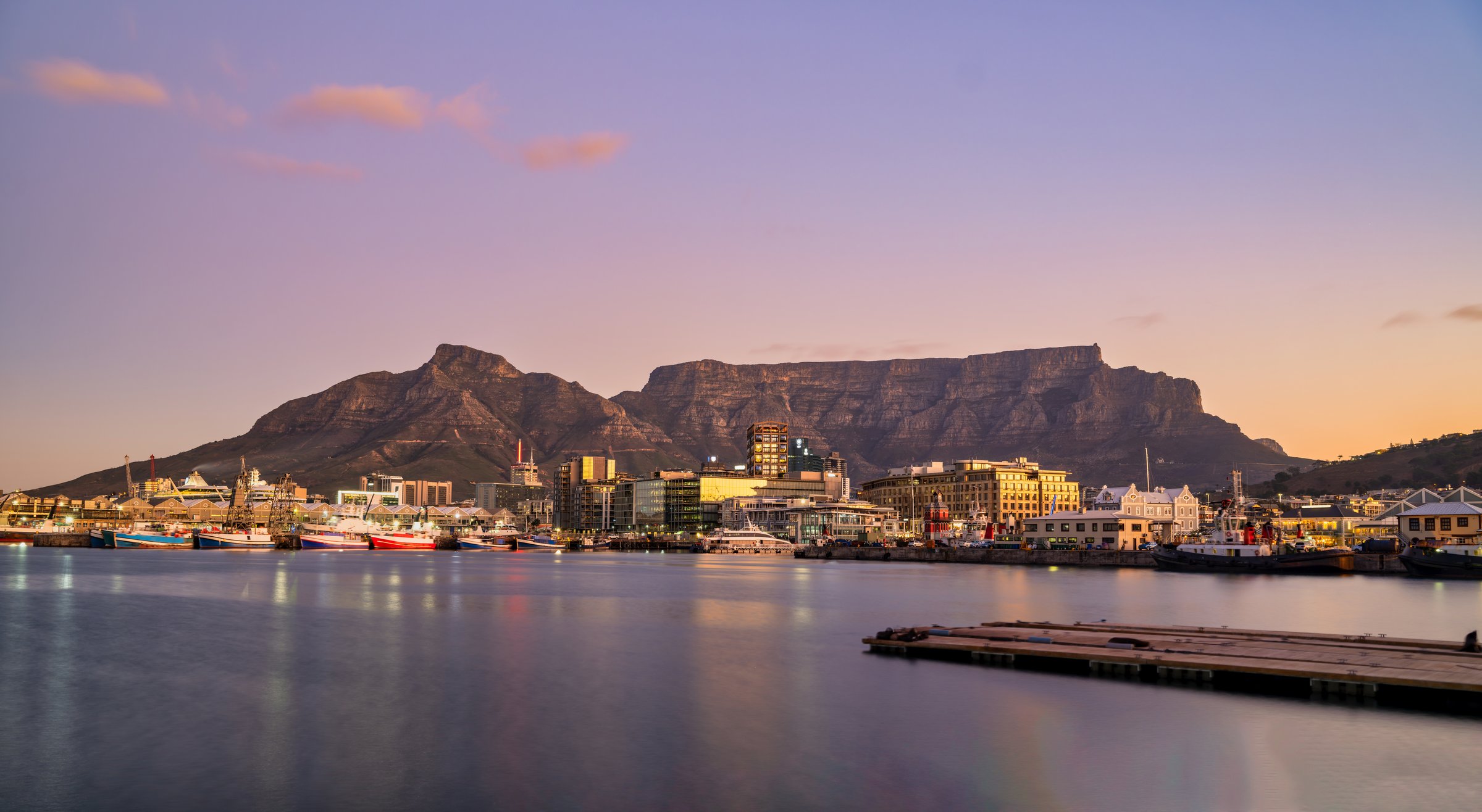 victoria & alfred v&a waterfront and table mountain in the background during sunset, Cape Town, South Africa