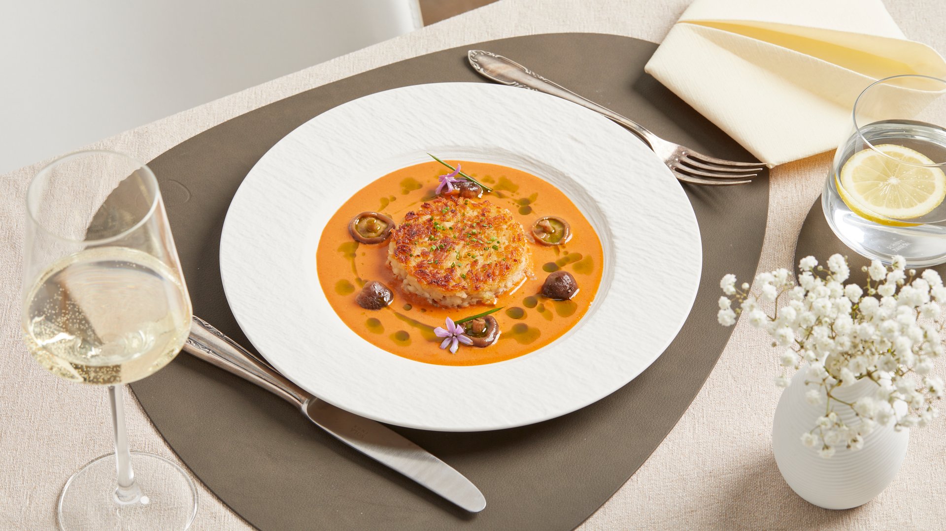 Creamy vegan risotto with mushrooms and a vibrant orange sauce – served warm as a festive plant-based main course for holiday menus or special occasions.