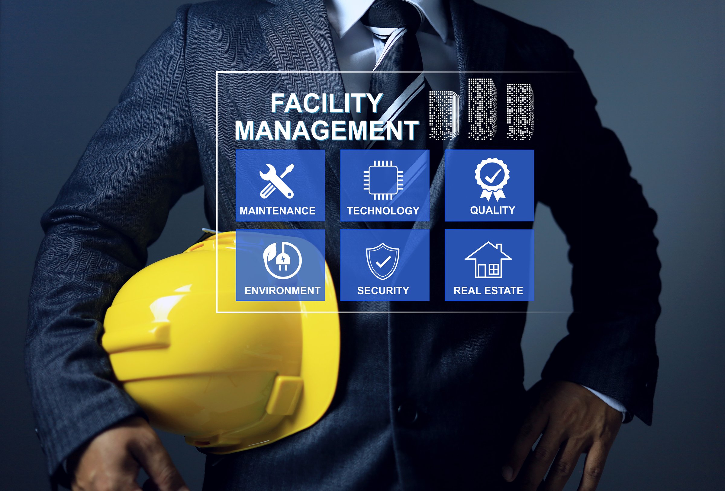 Facility management concept with engineering manager is holding yellow helmet to manage and monitoring facility works infrastructure system in smart city and manufacture plant