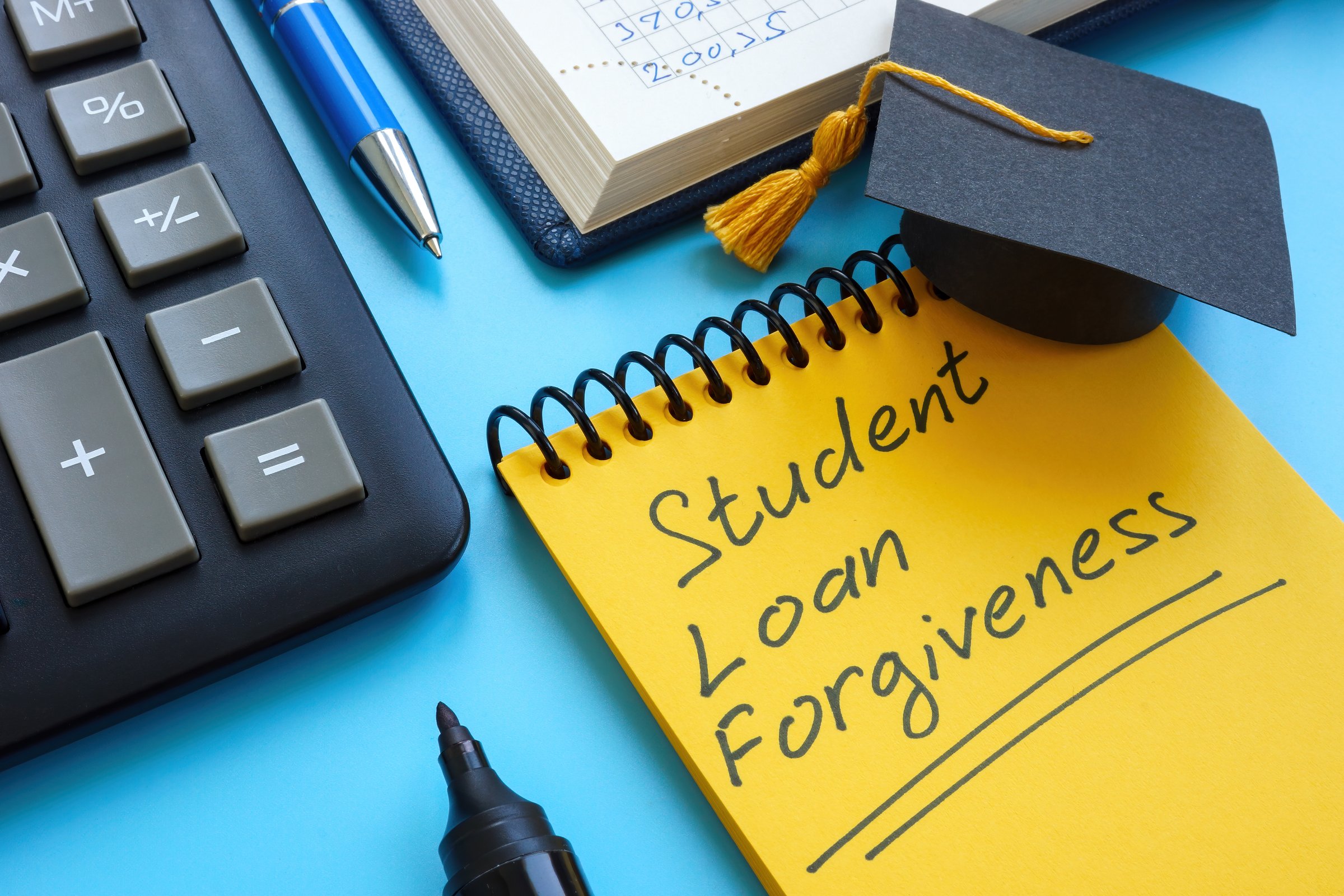 Graduation cap and Student loan forgiveness on page.