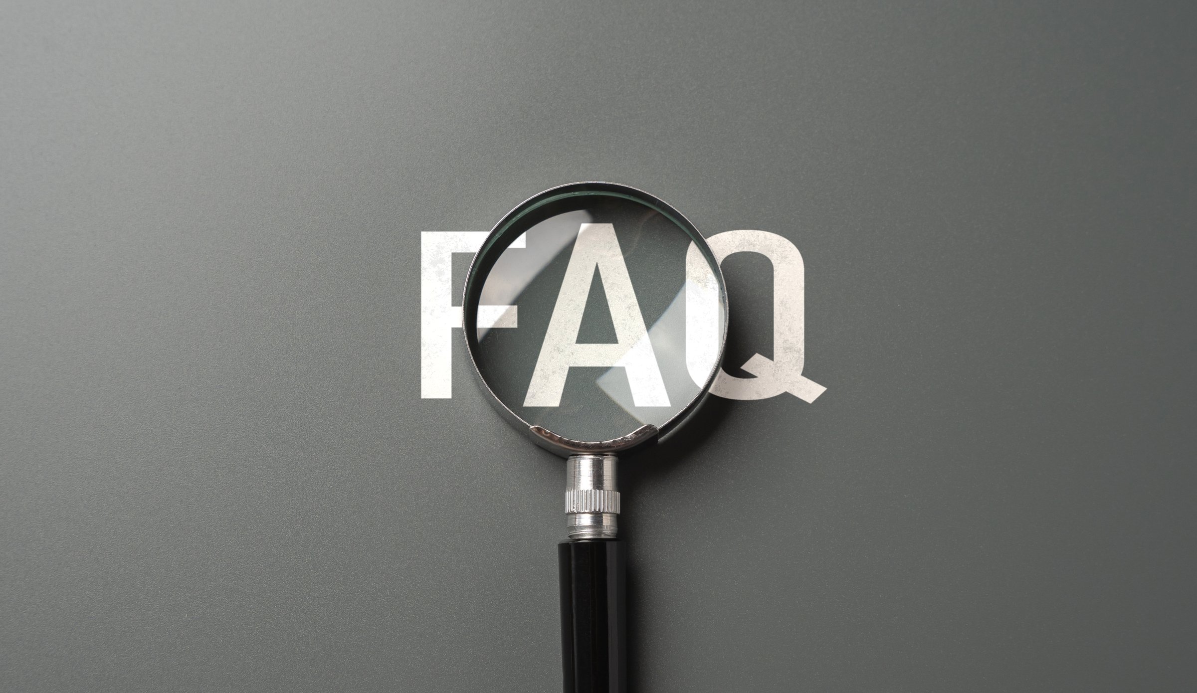 FAQ and magnifying glass. Frequently asked questions. Topic navigation. Simplify complexities, find answers, and make informed decisions