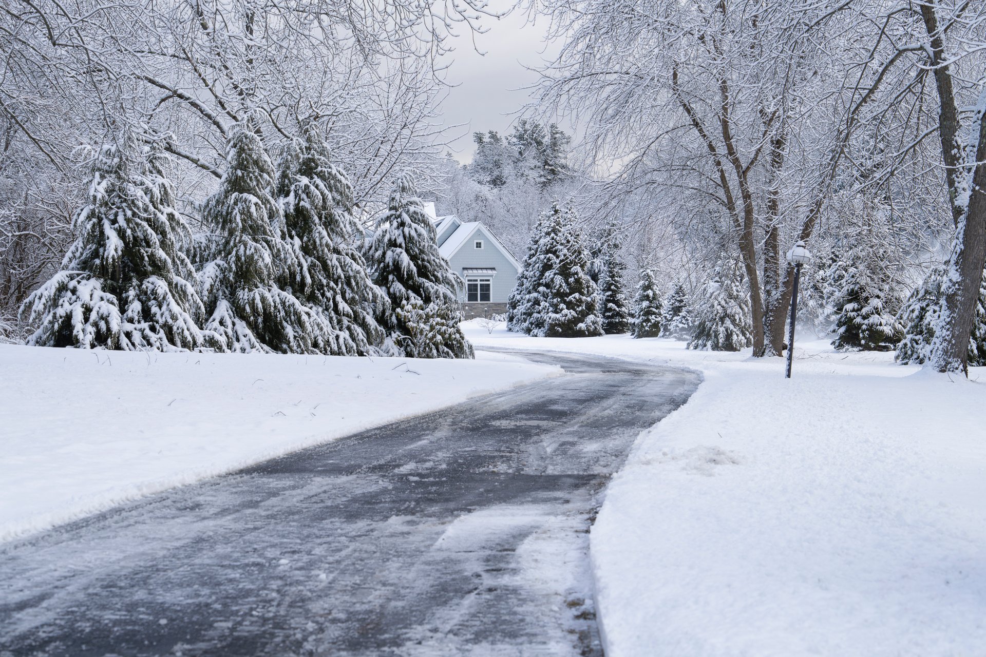 winter house and driveway after snow storm