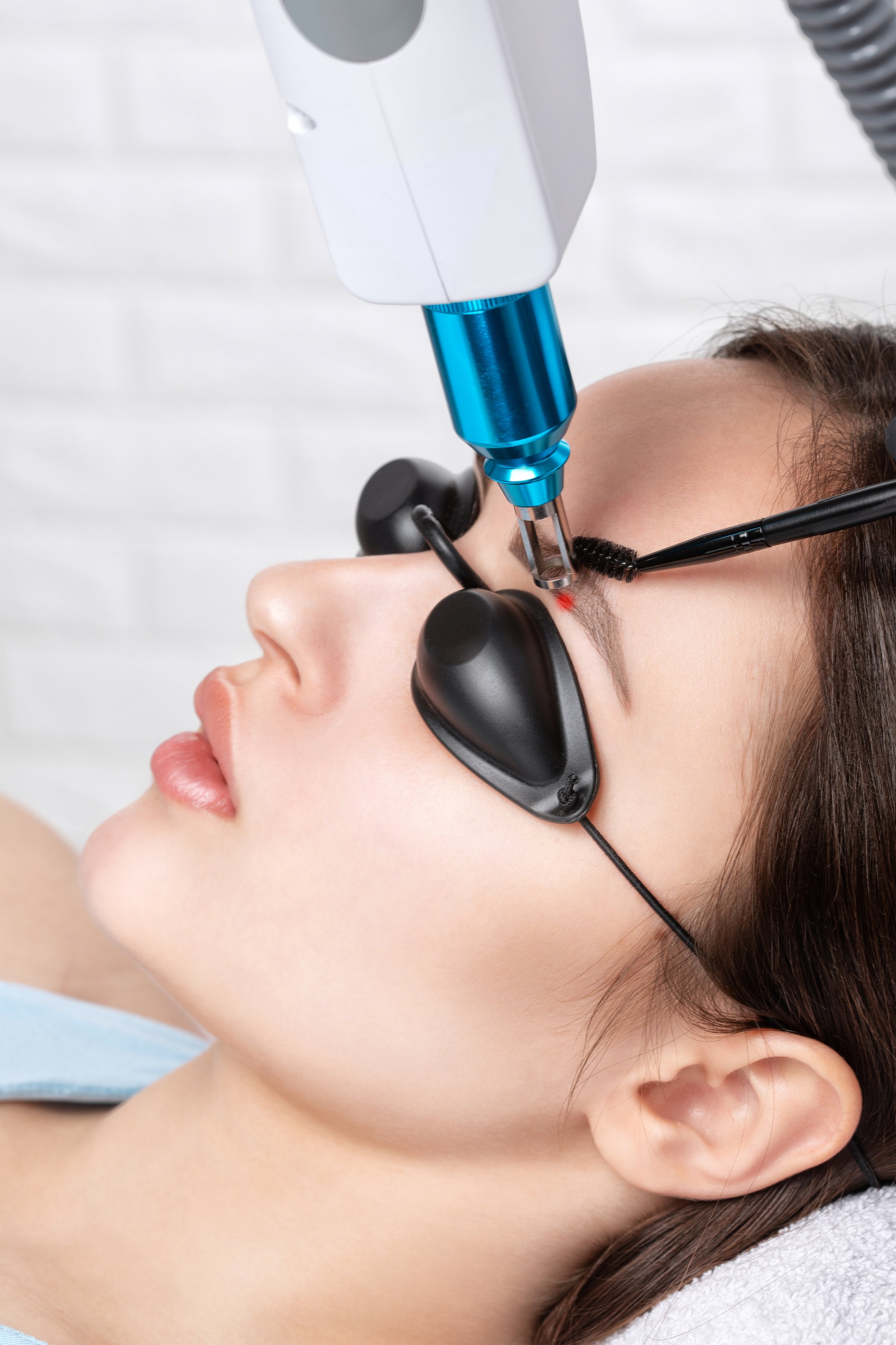 Carbon face peeling in a beauty salon. Hardware cosmetology treatment.