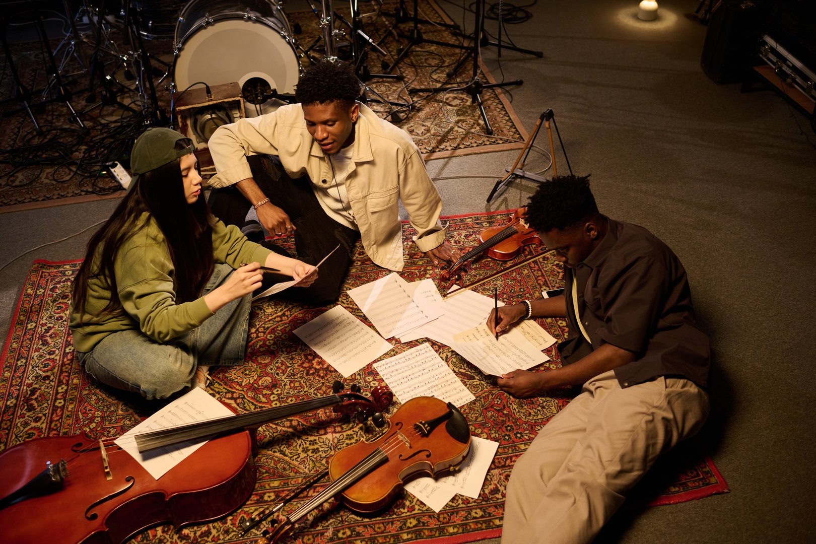 Multiethnic group of young adults collaborating on music composition