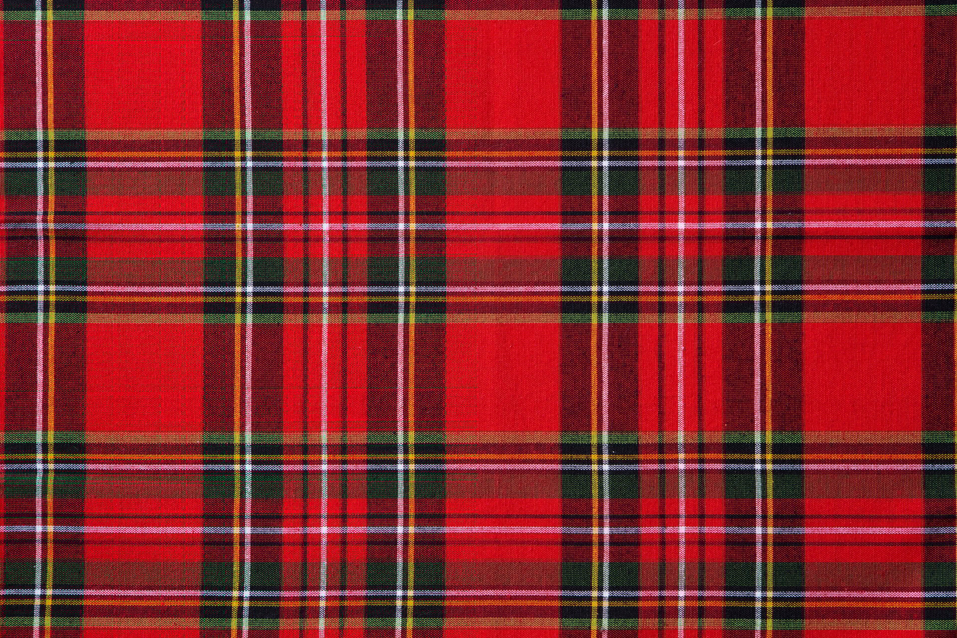 Tartan pattern, checkered, colored, seamless fabric for design or wallpaper background. Close up. Copy space. Top view.