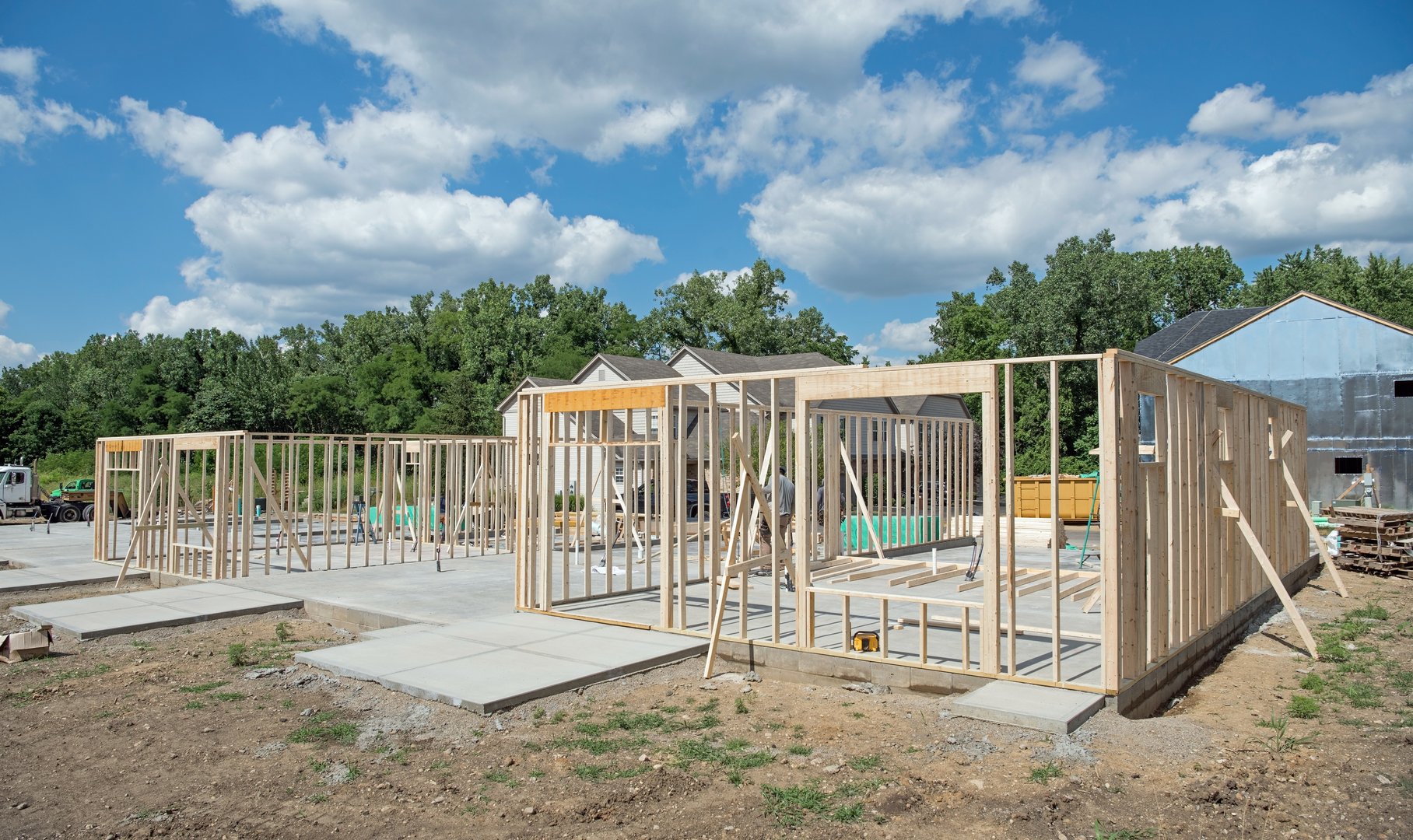 Construction framework of new condo housing development on cement slab foundation.