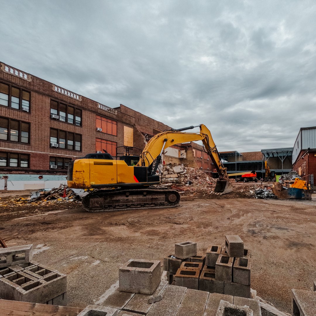 Large scale construction and demolition site with heavy equipment