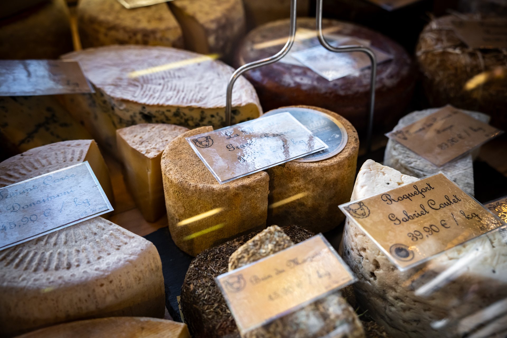 Assortment of French cheeses on display in Fromagerie display window in France