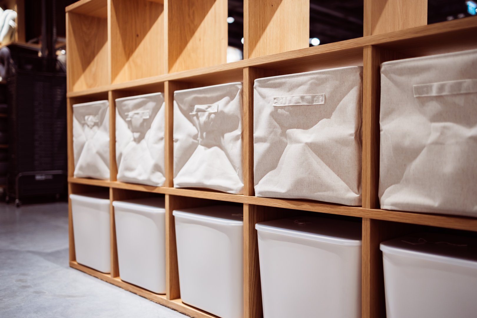 An organized retail display with fabric and plastic storage bins offers neat shopping experience in modern store environment enhancing retail space with practical storage solutions