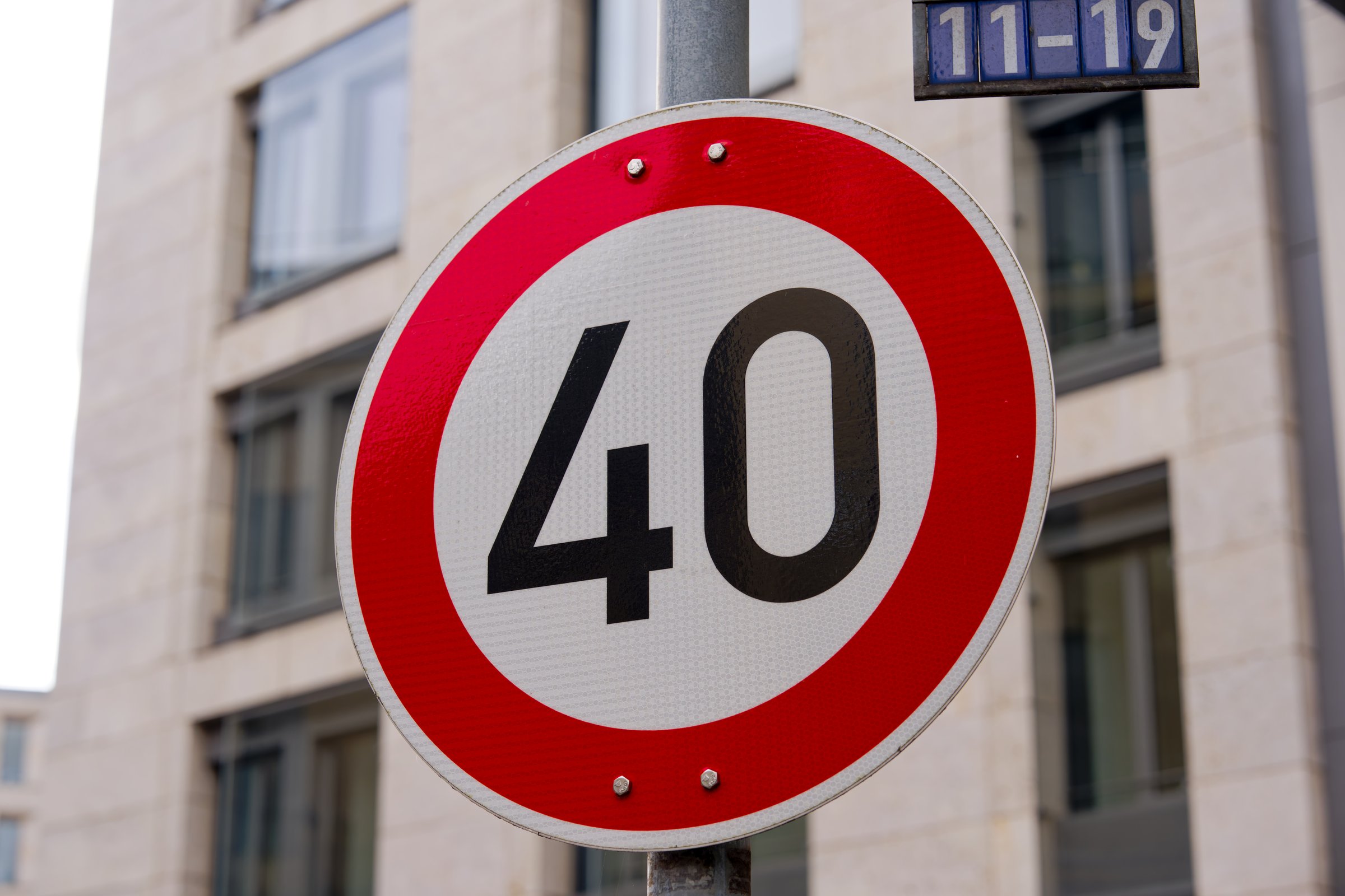 Close-up of 40 kmh speed limit road sign at German city of Frankfurt on an autumn day. Photo taken November 3rd, 2025, Frankfurt am Main, Germany.