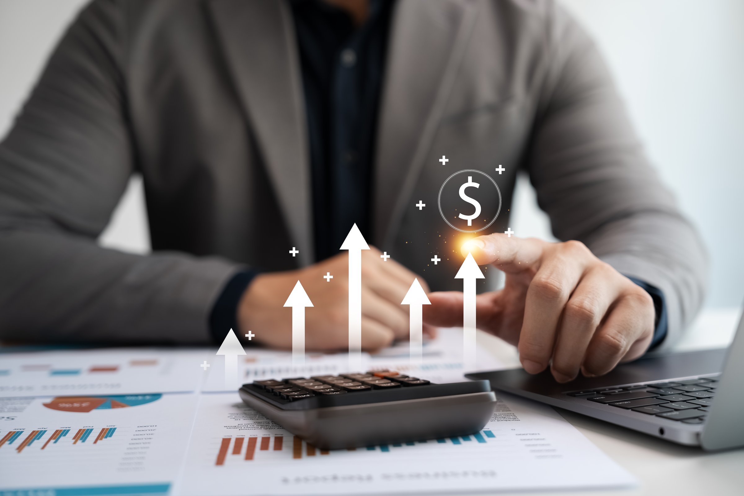 Concept of interest rates and dividends, currency symbol and up arrow, long term investment for retirement, stock and mutual fund returns.