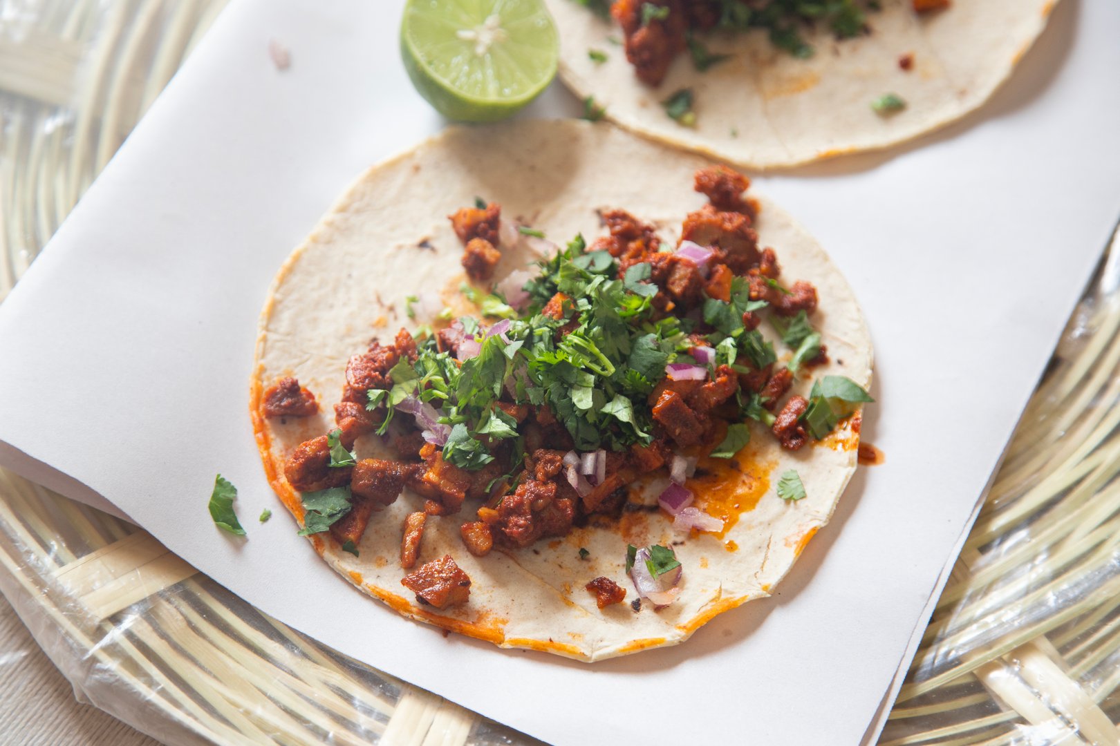 Mexican tacos with handmade tortillas with red pork chorizo ​​and spicy green sauce..