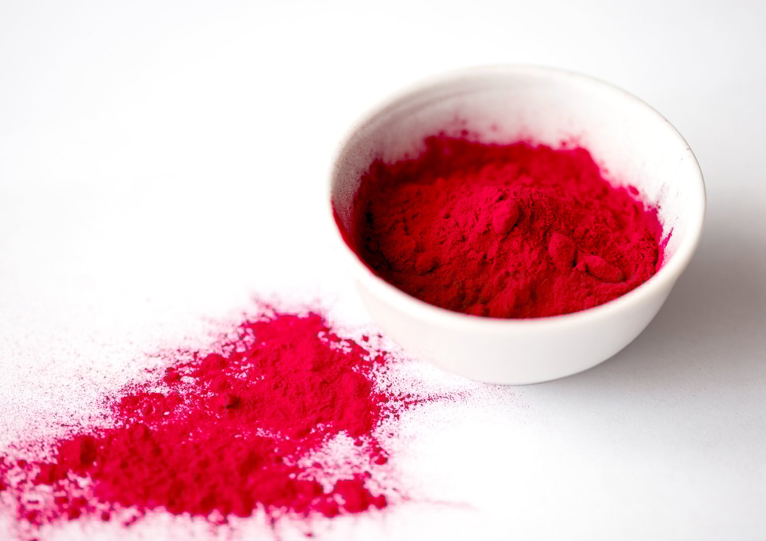 Organic Beetroot Powder in a White Ceramic Bowl. Beet Root Juice Powder. Superfood Concept.