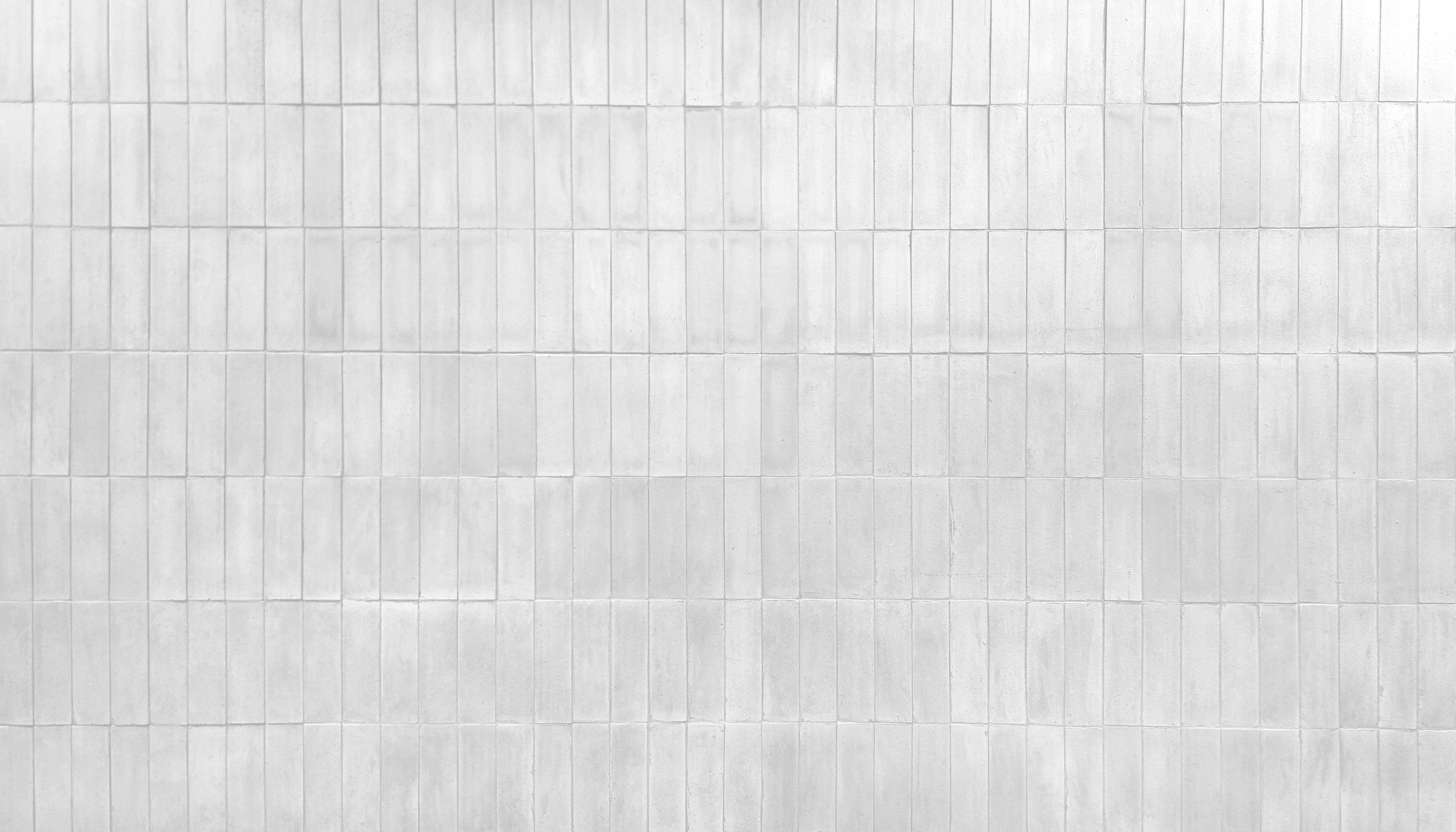 rustic white brick wall texture. weathered brickwork background for vintage designs. distressed brick wall surface. aged brickwork in vertical pattern for industrial interiors design.