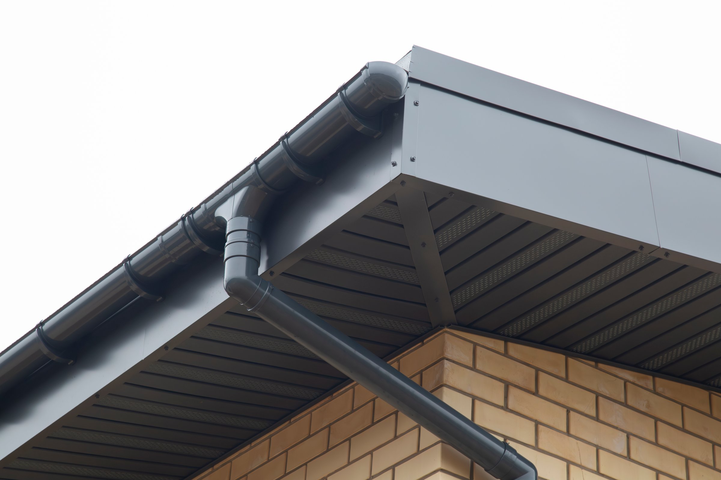 Modern guttering on a modern roof. Roof drainage.