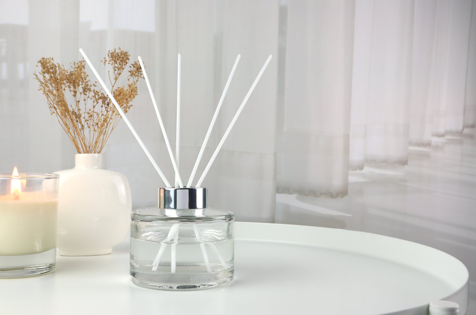 luxury aroma essential oil reed diffuser air freshener bottles on nice table in the modern design living room  for relax ambient in the evening on Valentine day