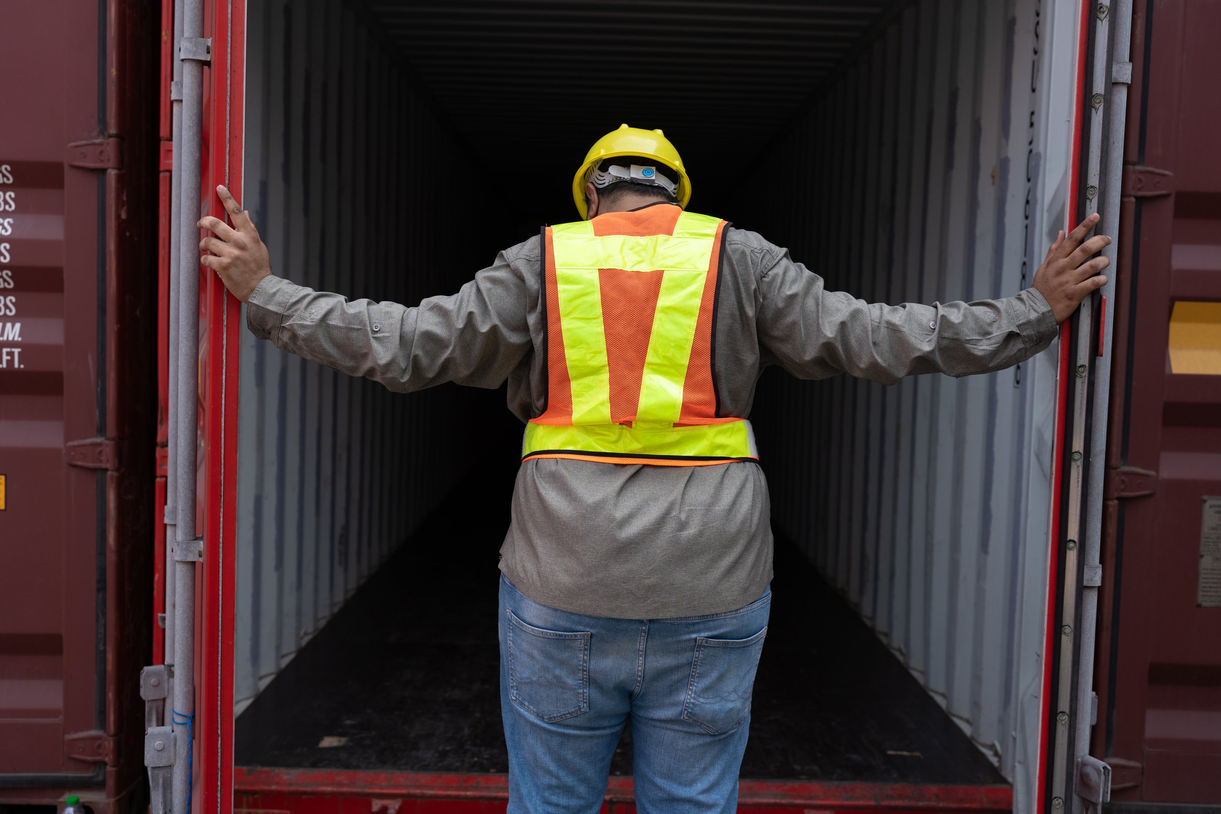 Middle east logistic worker engineer or foreman open the door container and working at container site
