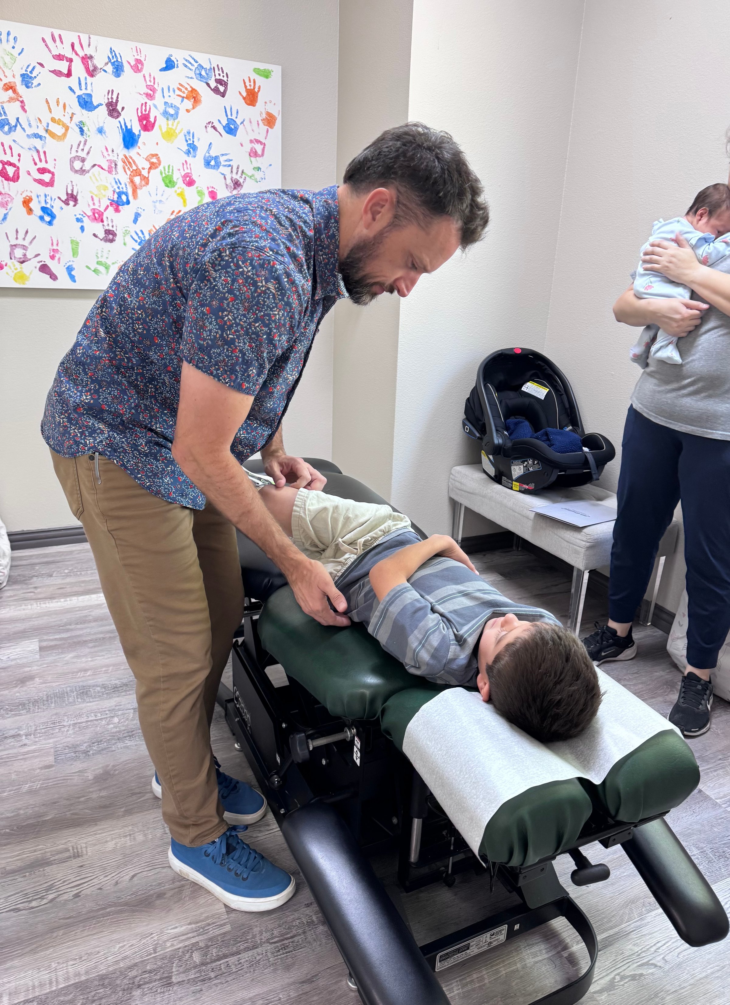 Family with child - gentle pediatric chiropractic care
