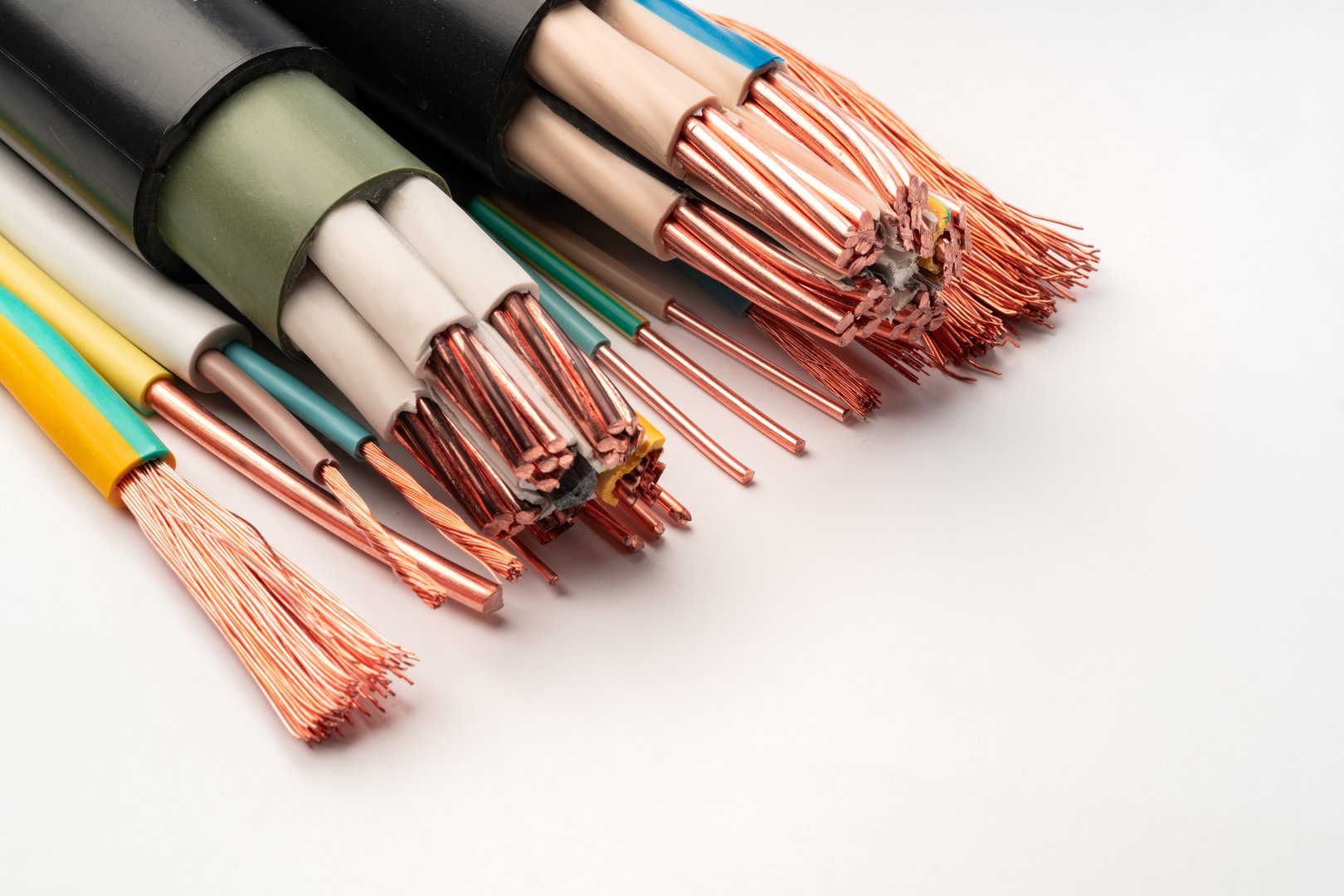 A close-up photograph of a bundle of multi-colored electrical wires with exposed copper strands.
