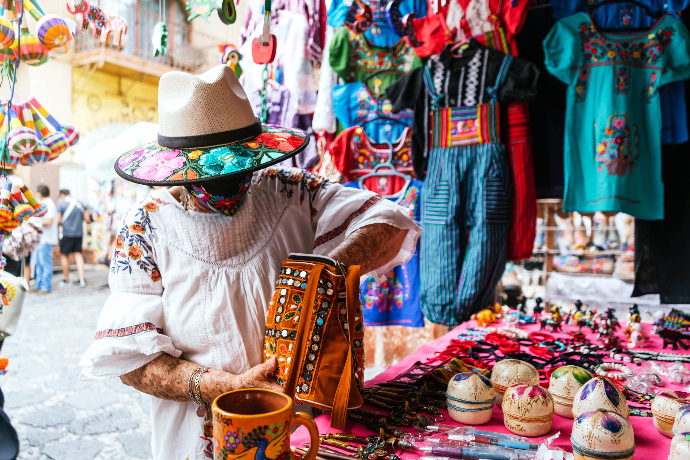 unrecognizable latina grandmother buying souvenirs. Tepoztlan, Mexico