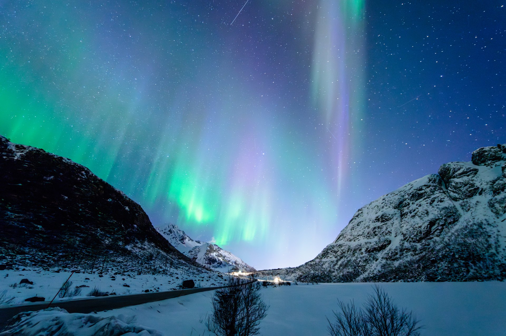 The Northern Lights during the night of April in late winter. Solar activity pursuing the transition from night to day.