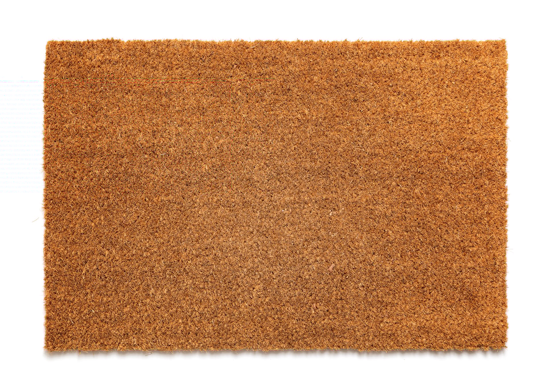 Natural brown coconut fiber doormat. Plain natural dry carpet on white background