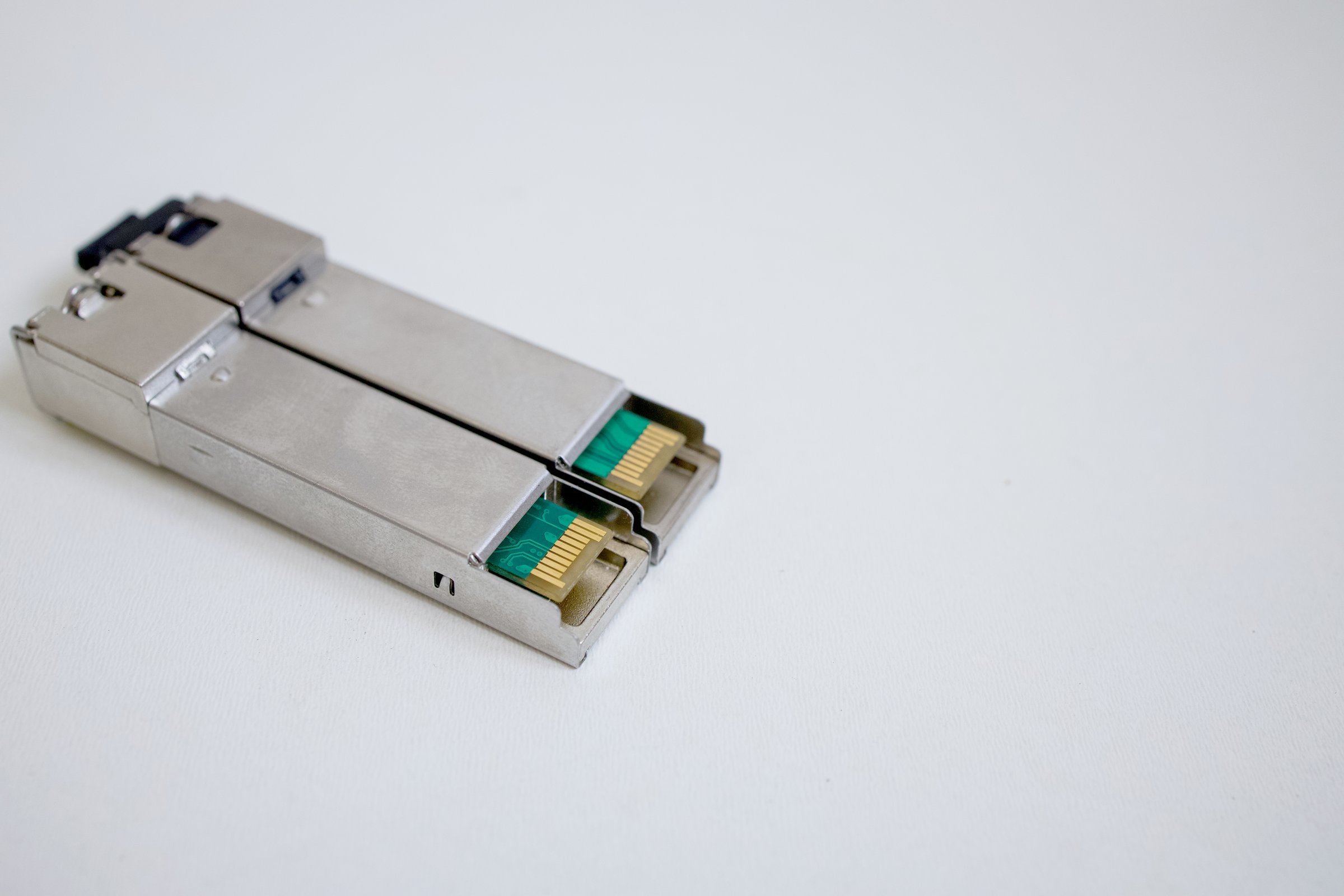 optical transceiver modules on a plain background