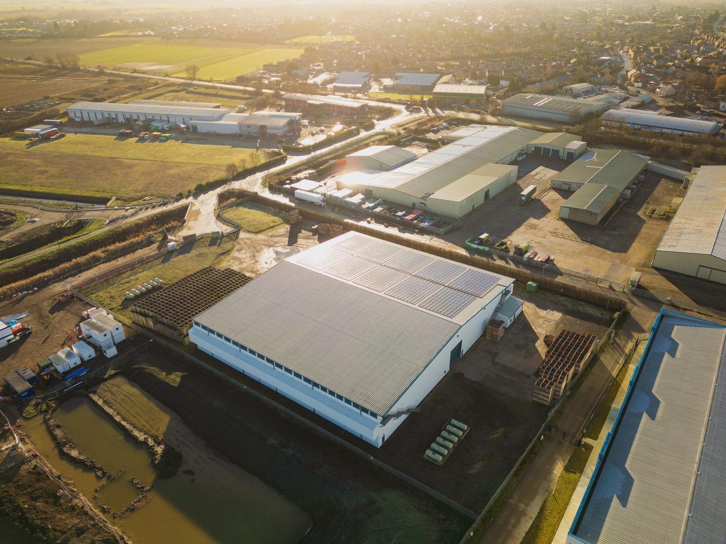 Large warehouse roof under strong sunlight in Dubai