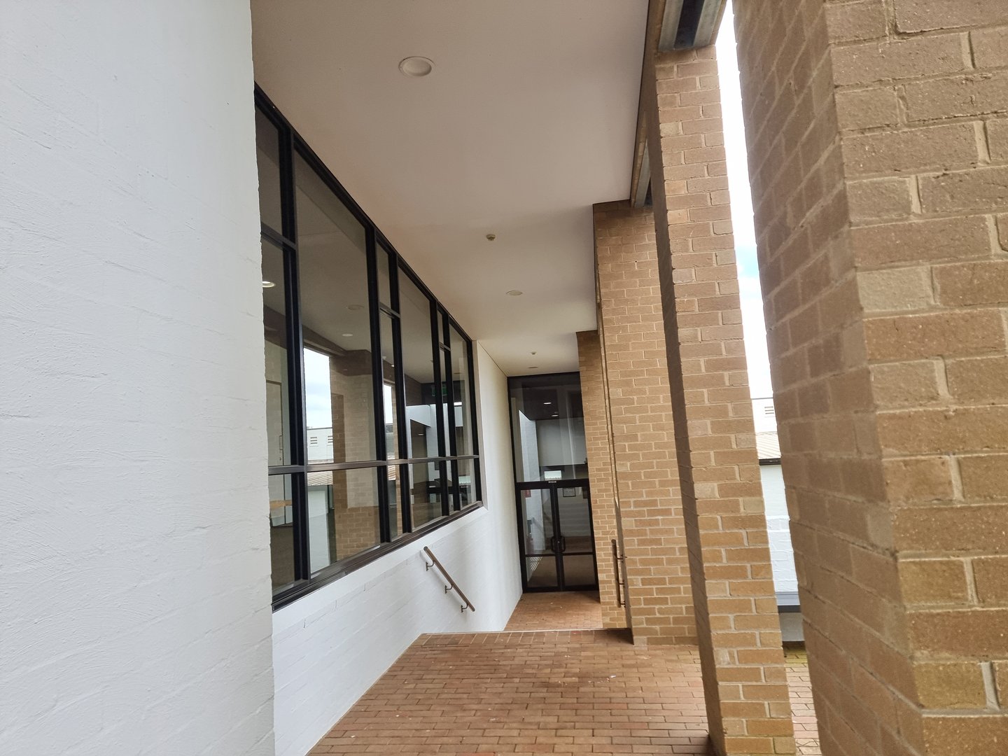 Quality Painting Group office building project - exterior detail work showing completed commercial coating application