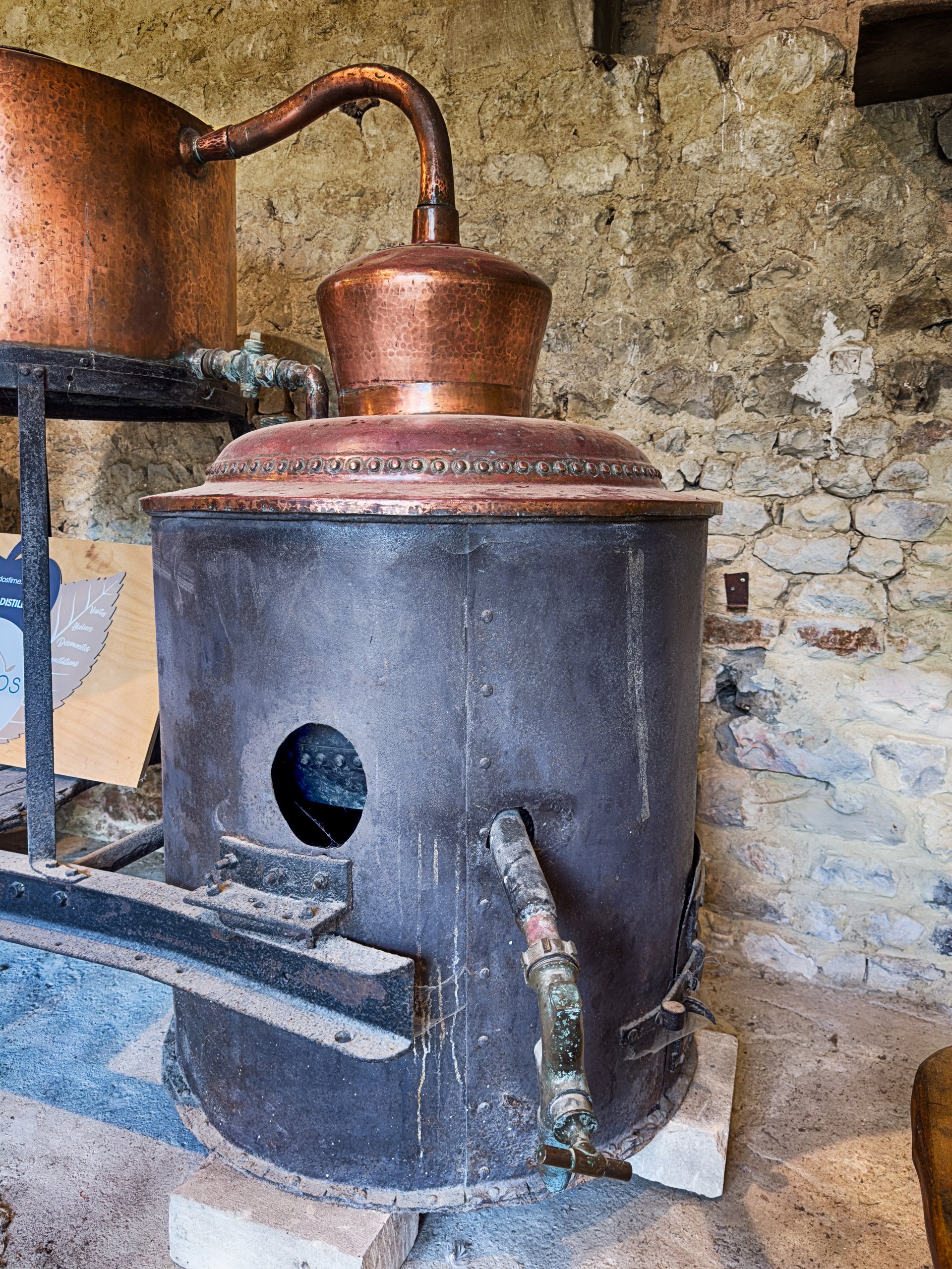 An old copper alembic pot still is used to distill apple spirits into Calvado in the small town of Audrieu in Normandy.
