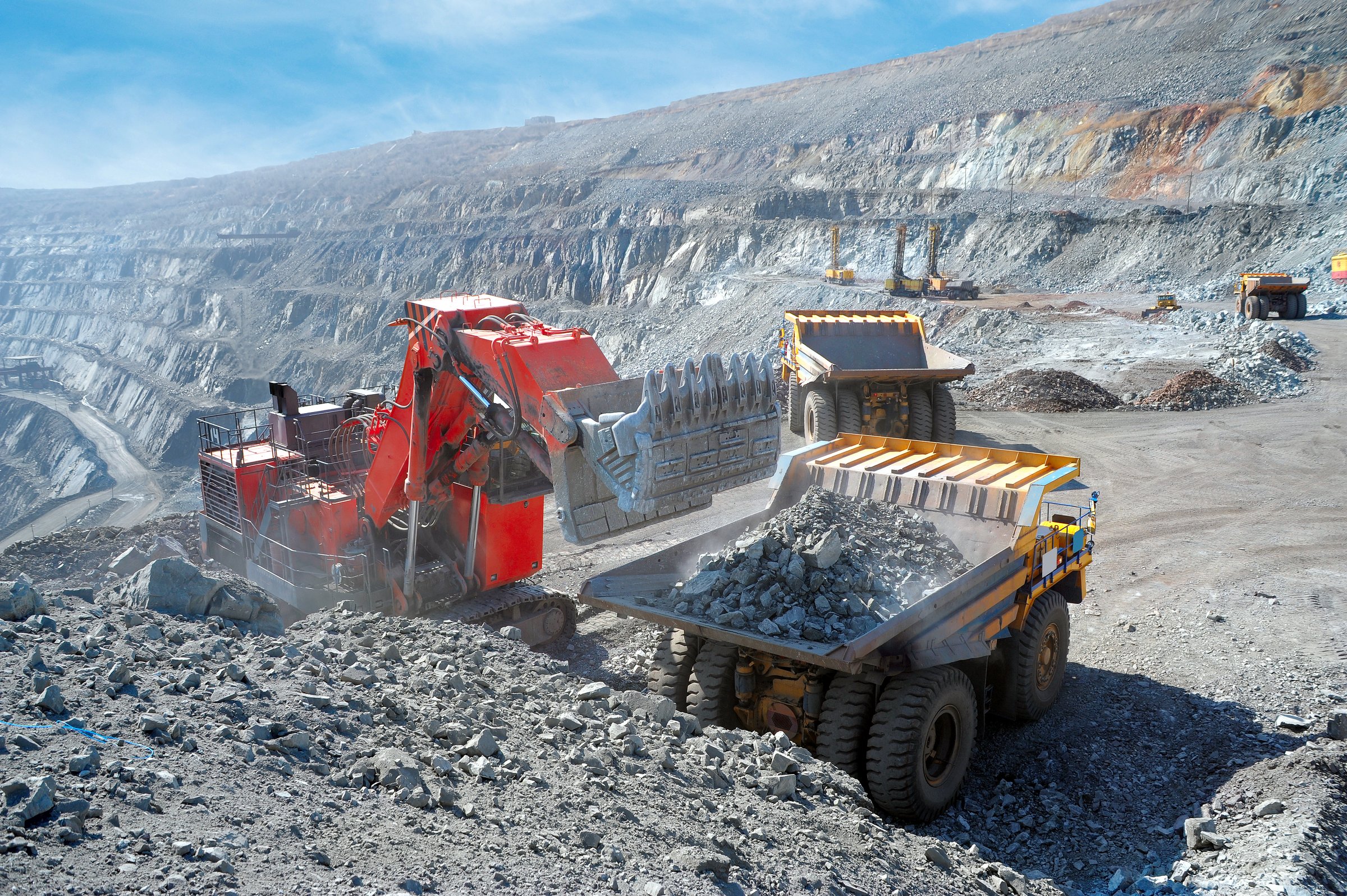 Loading of iron ore on very big dump-body truck