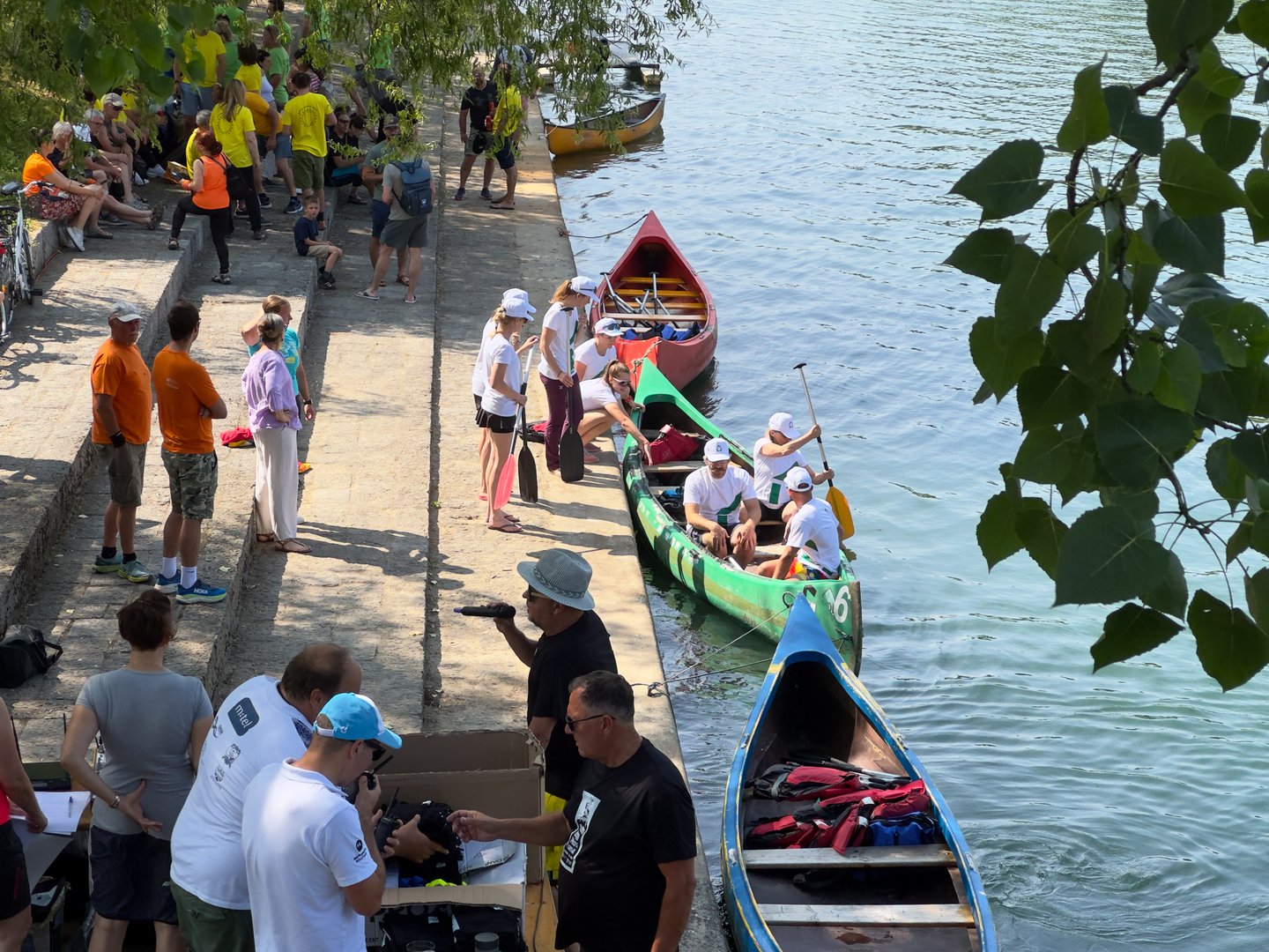 Ljubljana, Slovenia - 12.06.2025: Friendly interdistrict competition held at Trnovski Pristan under Prule Bridge, organized under the DECK project promoting environmental awareness and sustainability.