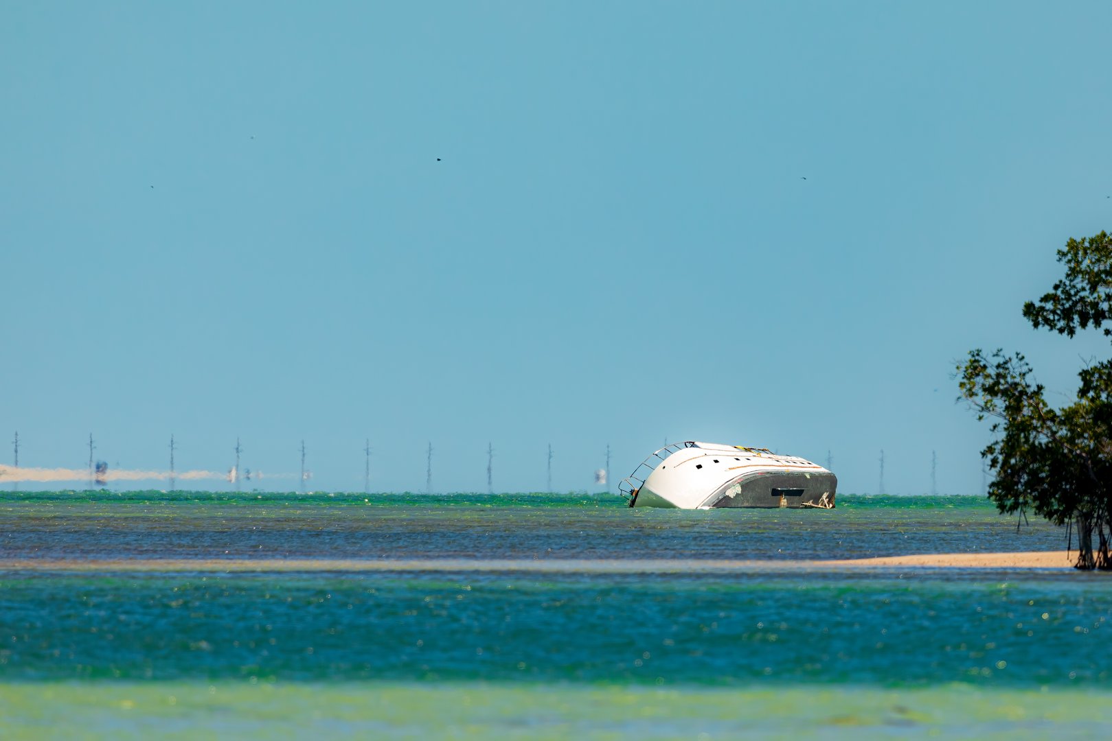 A capsized boat on a sandbar off the coast of Bahia Honda State Park