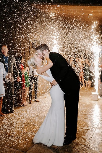 Snow machine creating magical winter wonderland effect at wedding exit