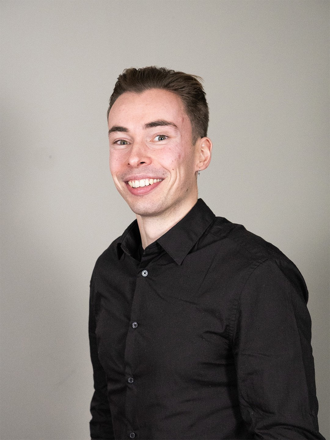 A diverse group of business professionals smiling confidently in a modern office environment. Their teamwork and cohesion portray leadership, unity, and professionalism, symbolizing success in diverse corporate settings.