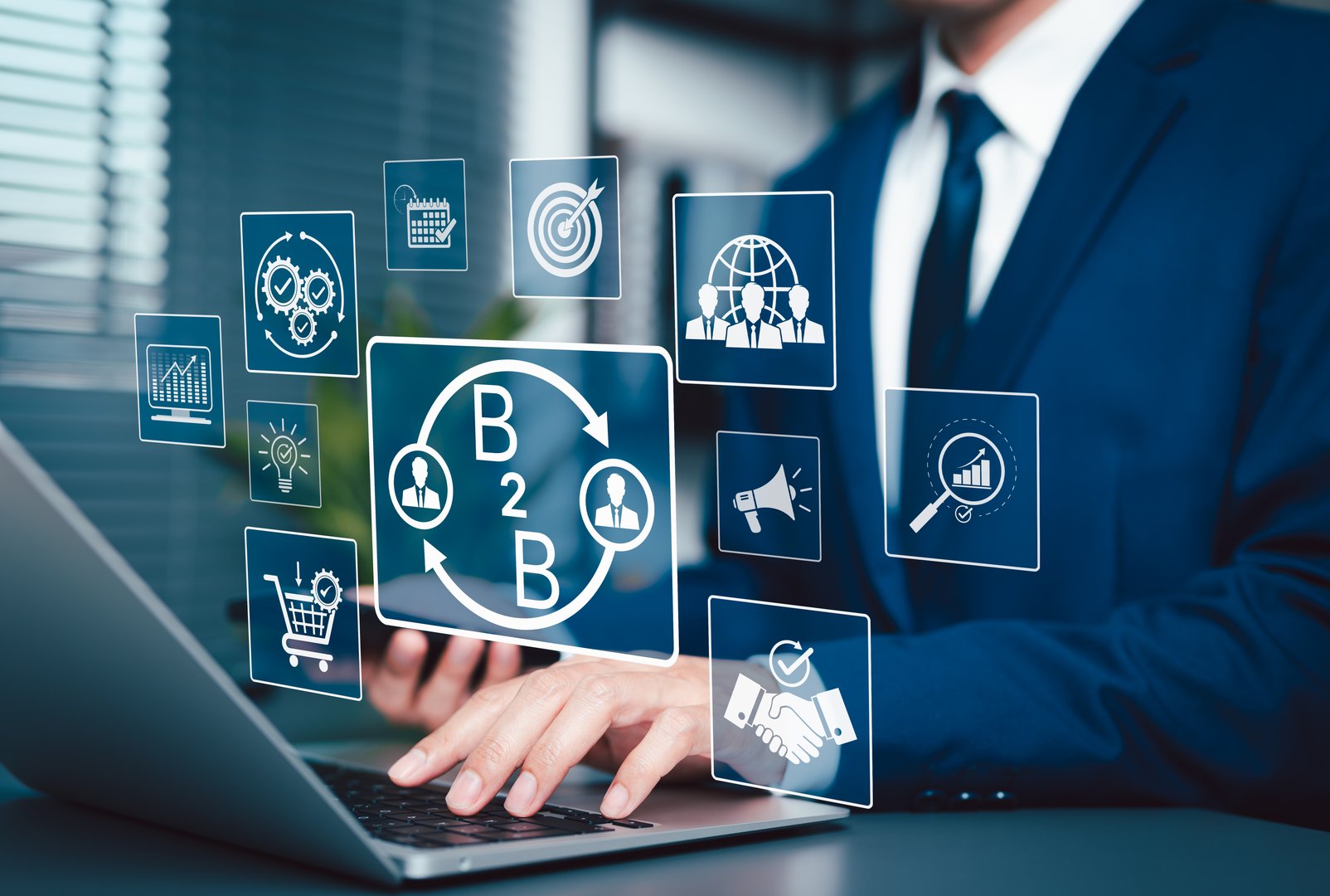 B2B Business Strategy and Digital Marketing Concept. Businessman working on laptop with B2B interface icons, business to business networking, marketing, sales, strategy, data analytics, B2B Marketing,