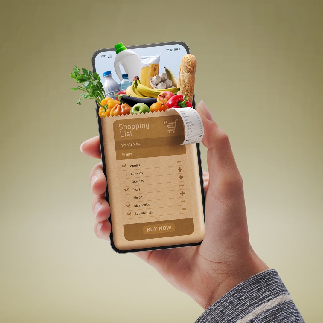Online grocery shopping app: customer holding a smartphone and ordering groceries online