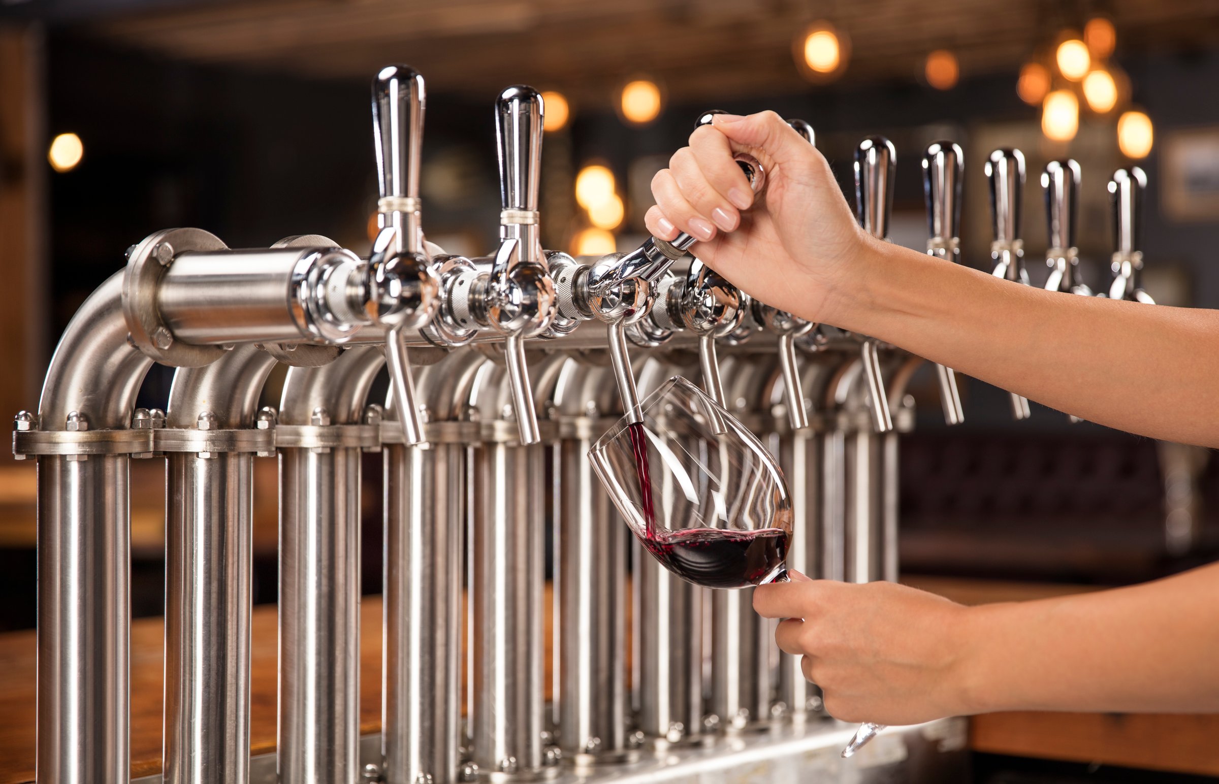 Wine being poured from a keg tap